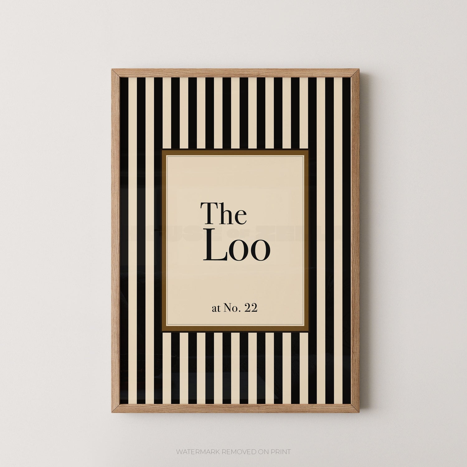 Personalised Wall Art - House of Zella - A striped print with a central section saying 'The Loo' pesonalised for a home. Art in an oak frame and hung on a pale wall.