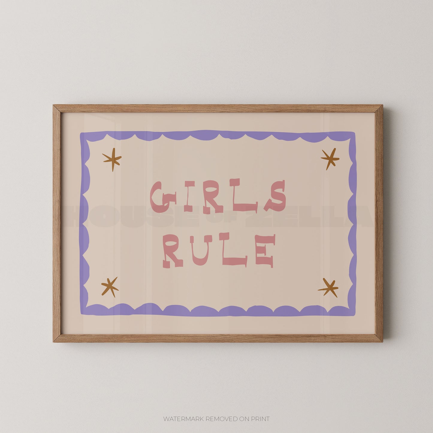 "Girls Rule children's wall art print with bold pink retro lettering on a cream background, purple scallop border with gold star details in each corner, displayed straight-on in an oak frame"

