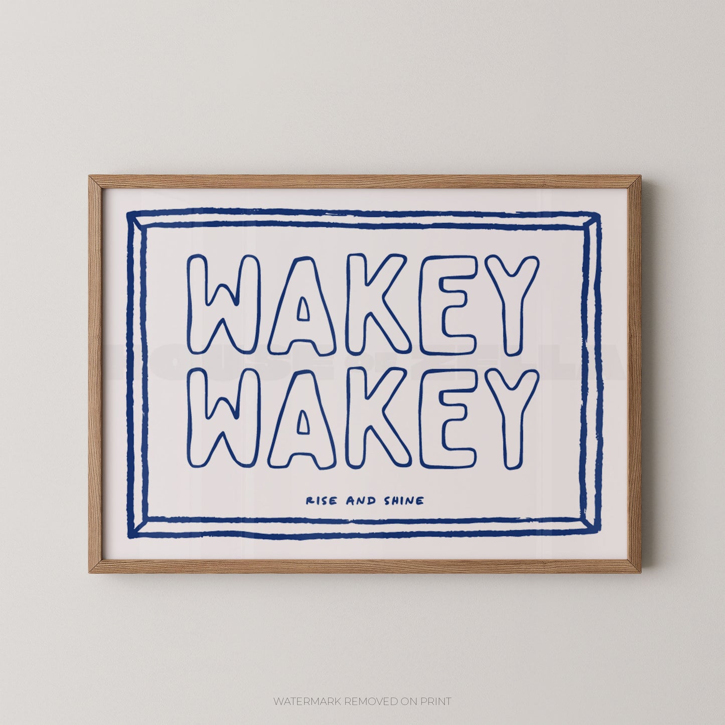 Framed print with 'Wakey Wakey' text on a white background