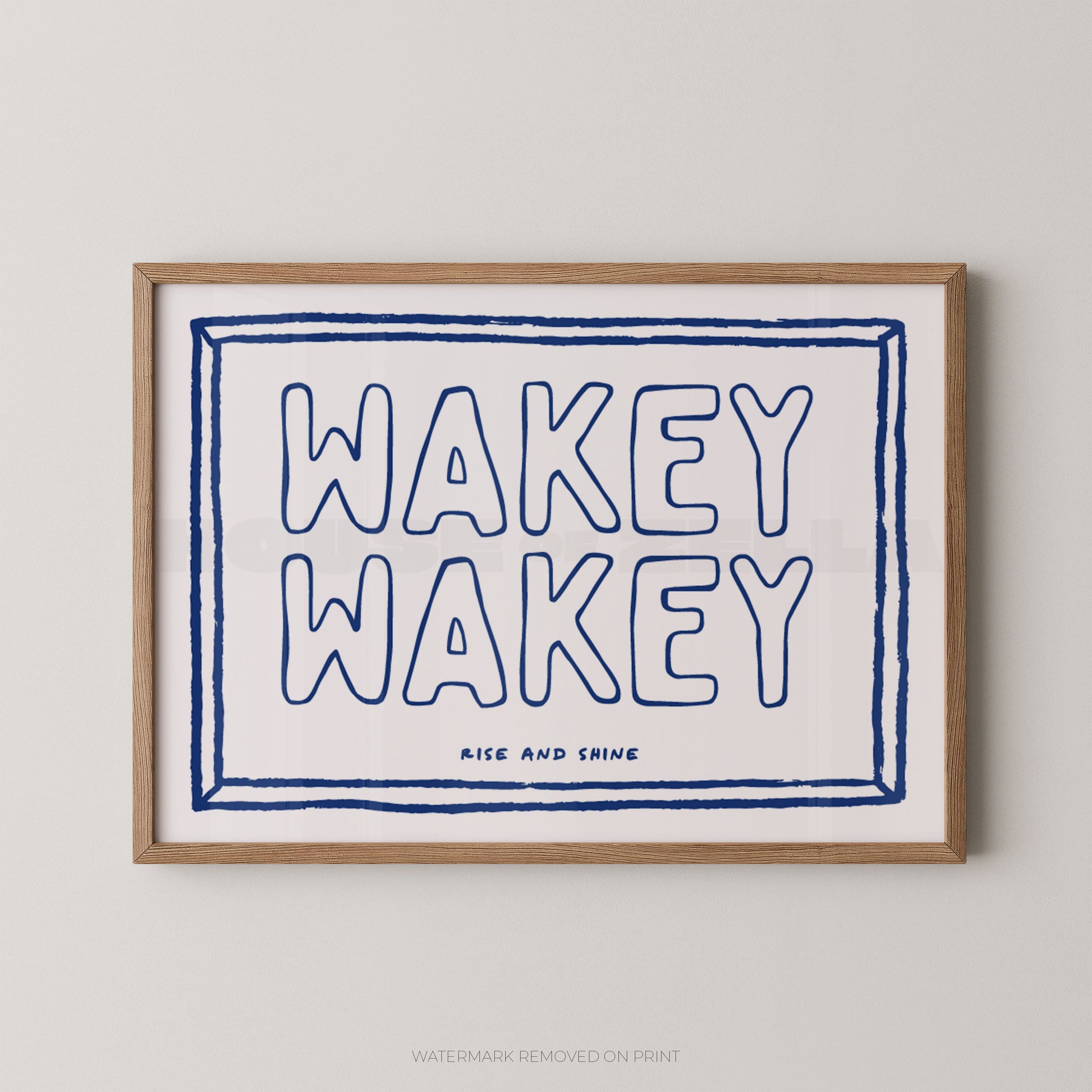 Framed print with 'Wakey Wakey' text on a white background