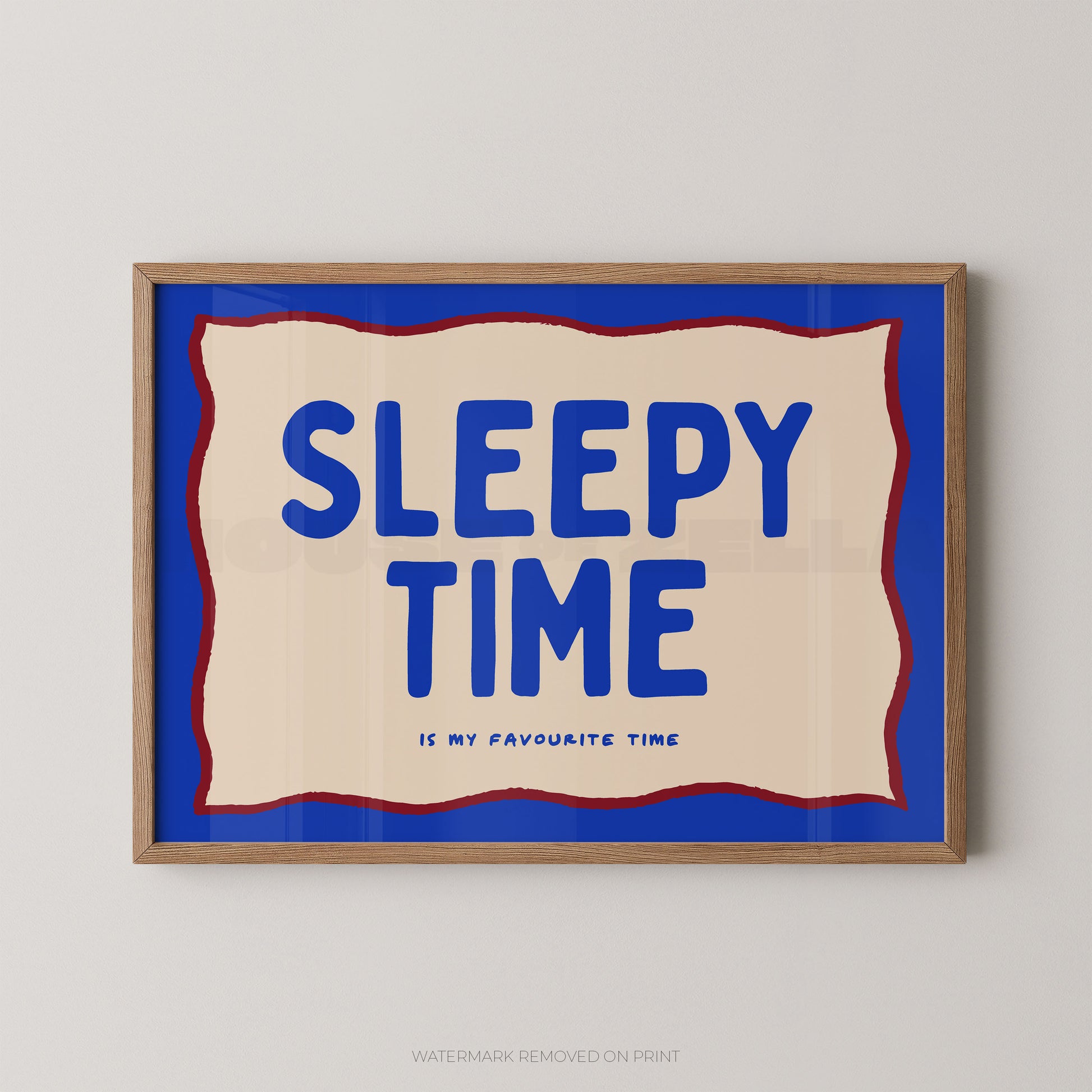 Framed artwork with 'Sleepy Time is my favourite time' text on a blue background