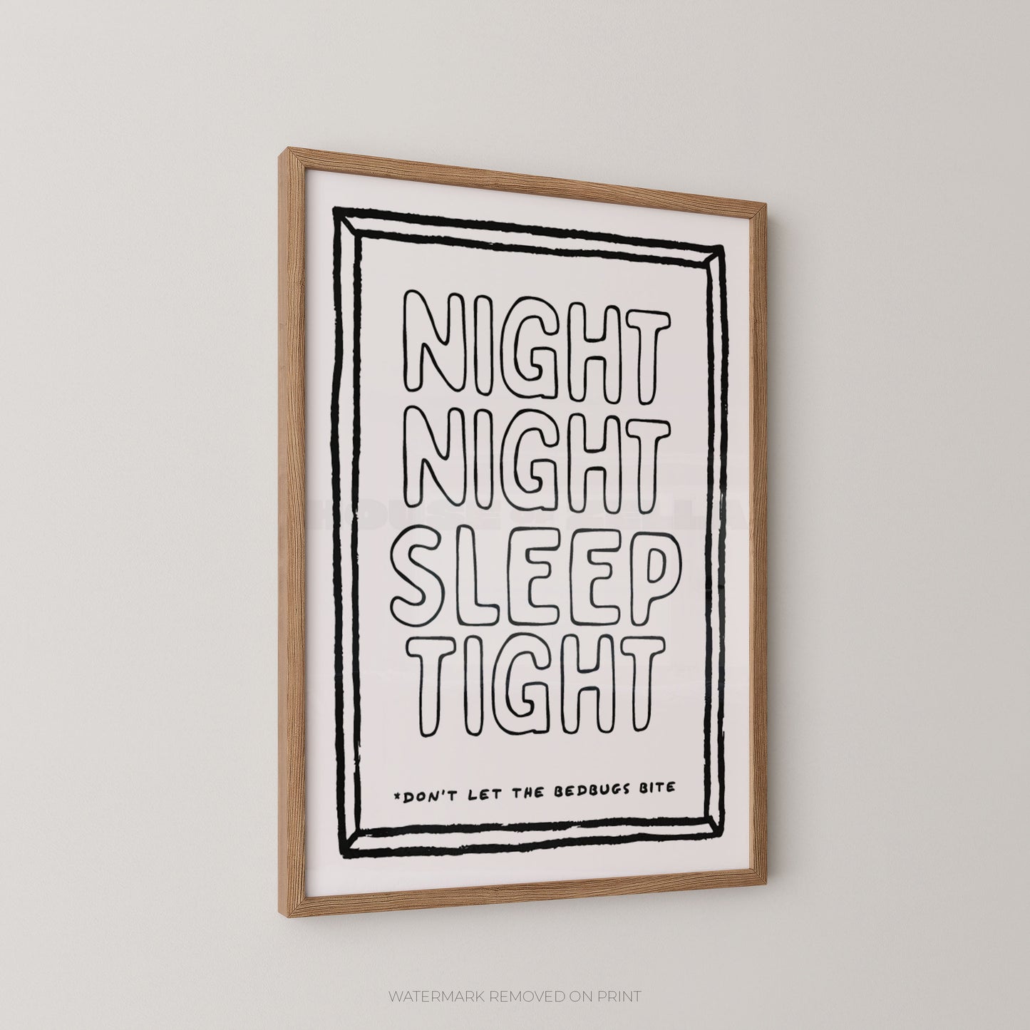 A framed typographic wall art print hanging on a light neutral wall. The print has a white background with black hand-drawn style text reading “NIGHT NIGHT SLEEP TIGHT” and smaller text below, plus a natural wood frame.