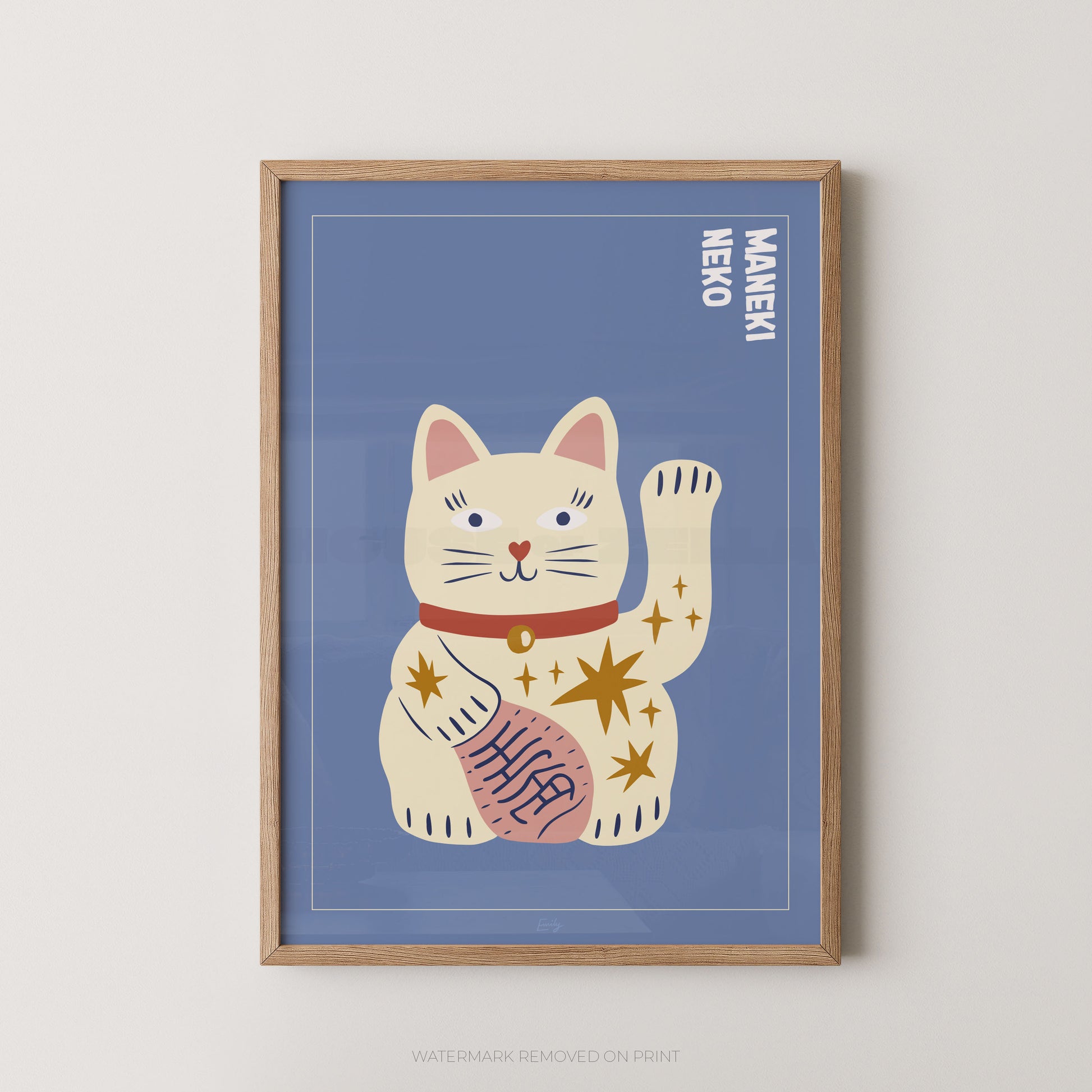 Framed artwork of a waving cat illustration with 'Maneki Neko' text on a blue background.