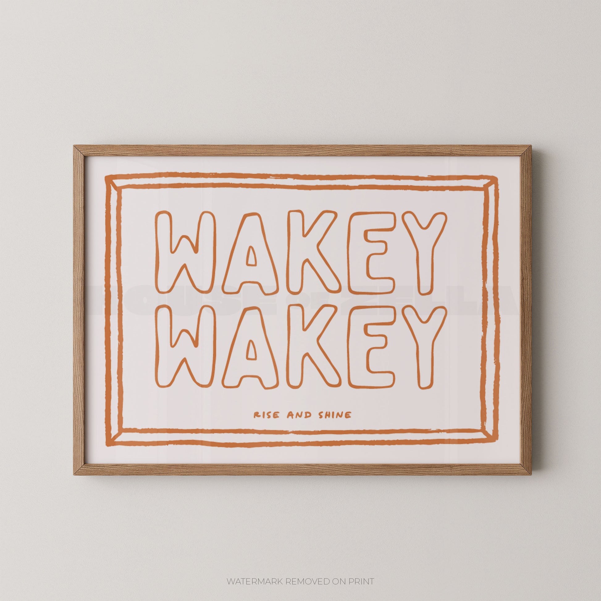 Framed print with 'Wakey Wakey' text on a plain background