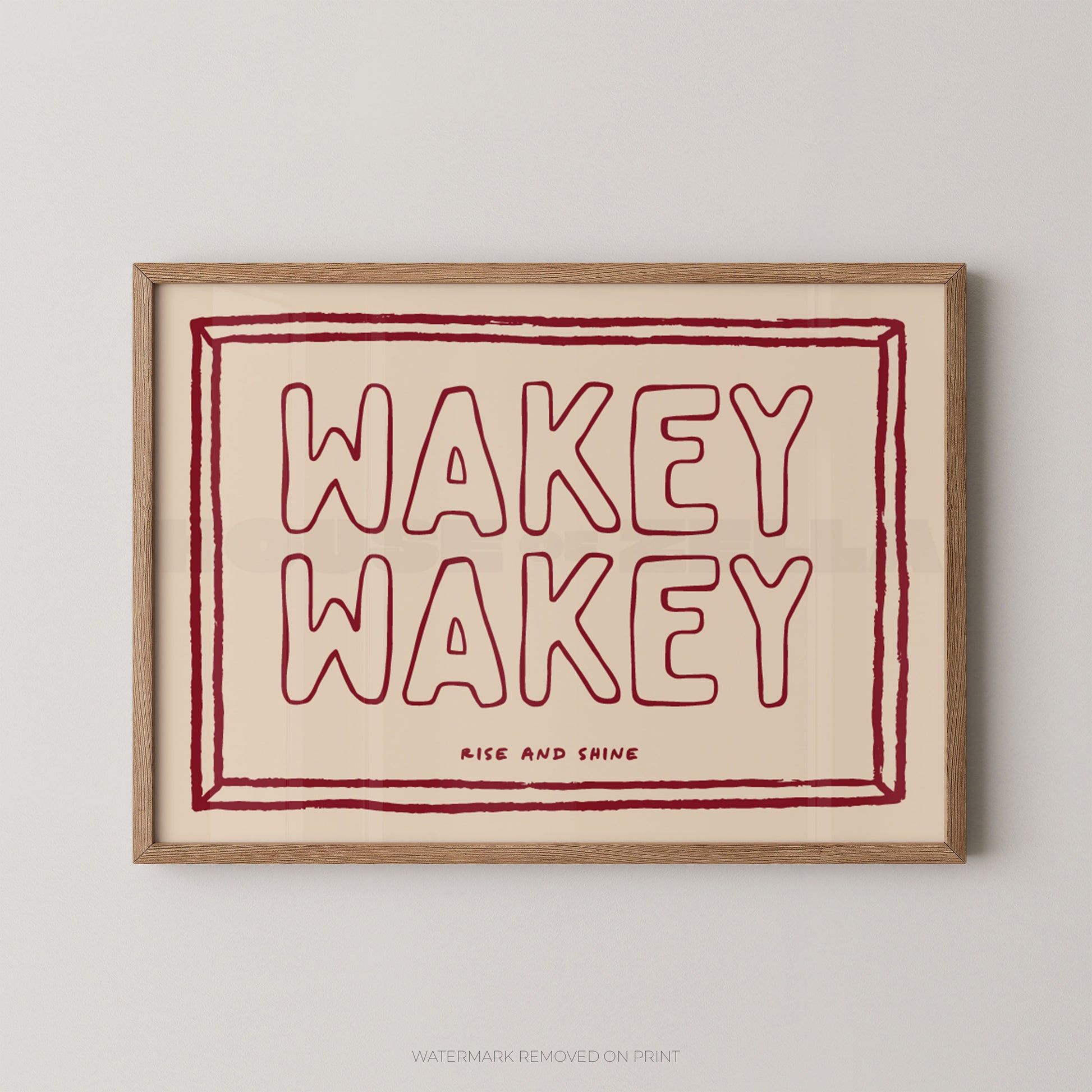 Framed artwork with 'Wakey Wakey' text on a beige background