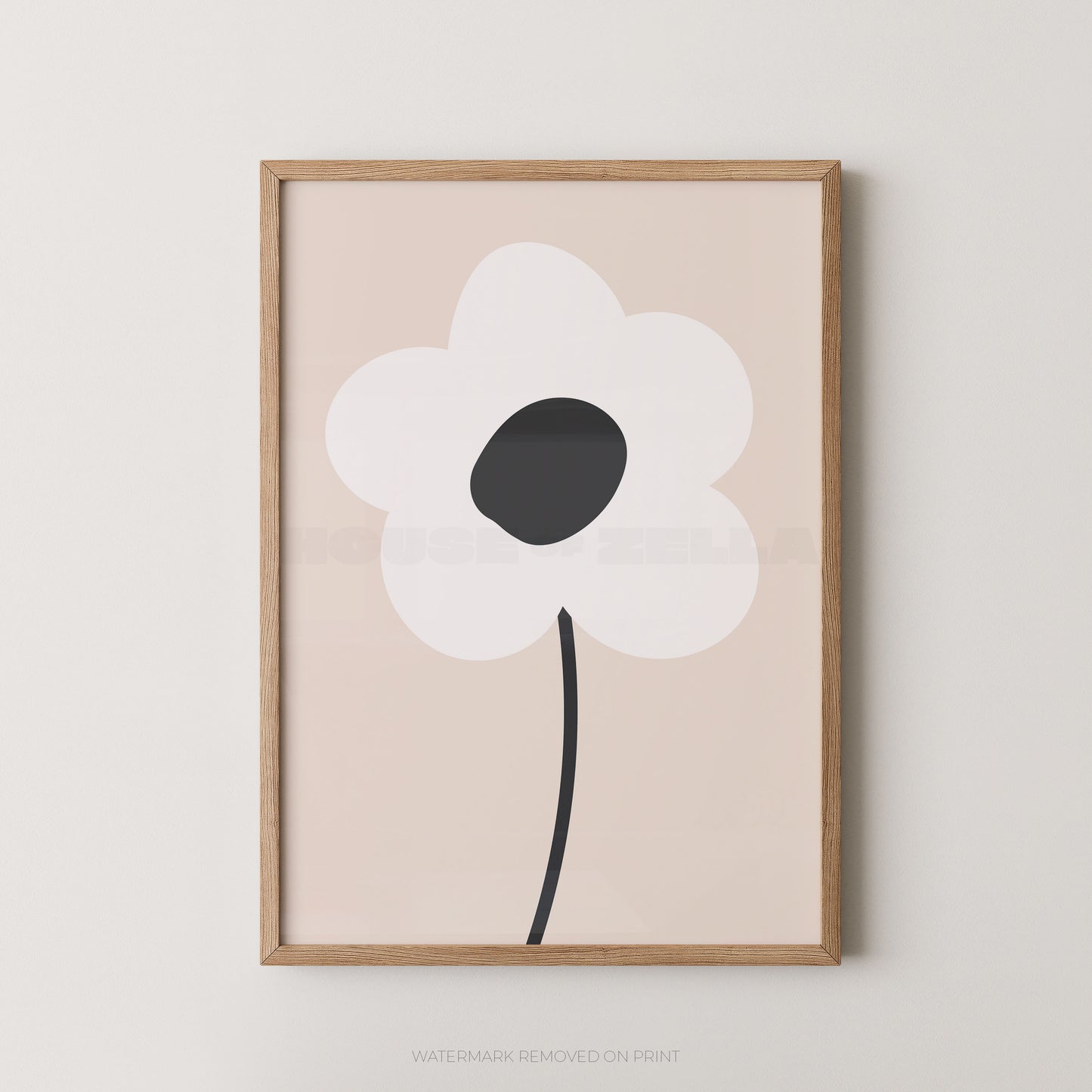 Framed minimalist floral wall art featuring a stylized white flower with a dark gray center and black stem on a pale blush background, set in a light natural wood frame against a neutral wall.