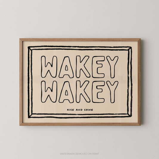 Framed artwork with 'Wakey Wakey' text on a beige background
