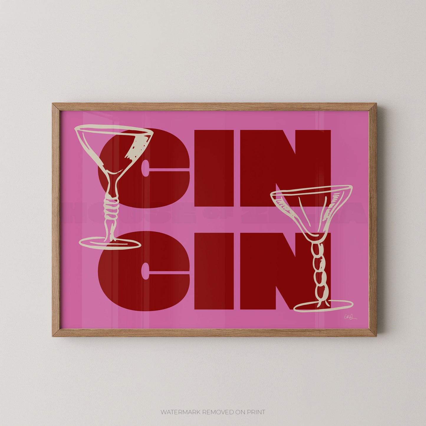 Framed artwork with 'CIN CIN' text and martini glass illustrations on a pink background.