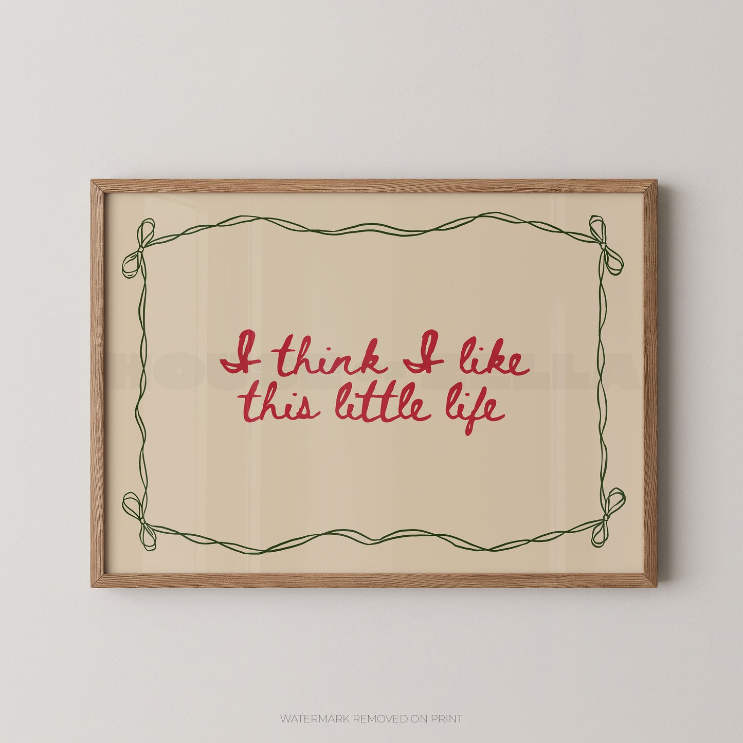 Framed print with 'I think I like this little life' text on a beige background