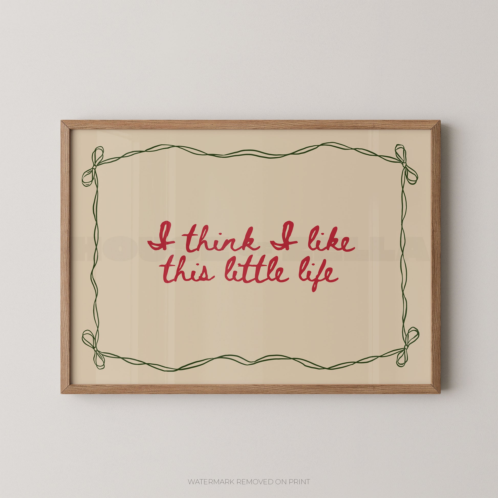 Framed print with 'I think I like this little life' text on a beige background