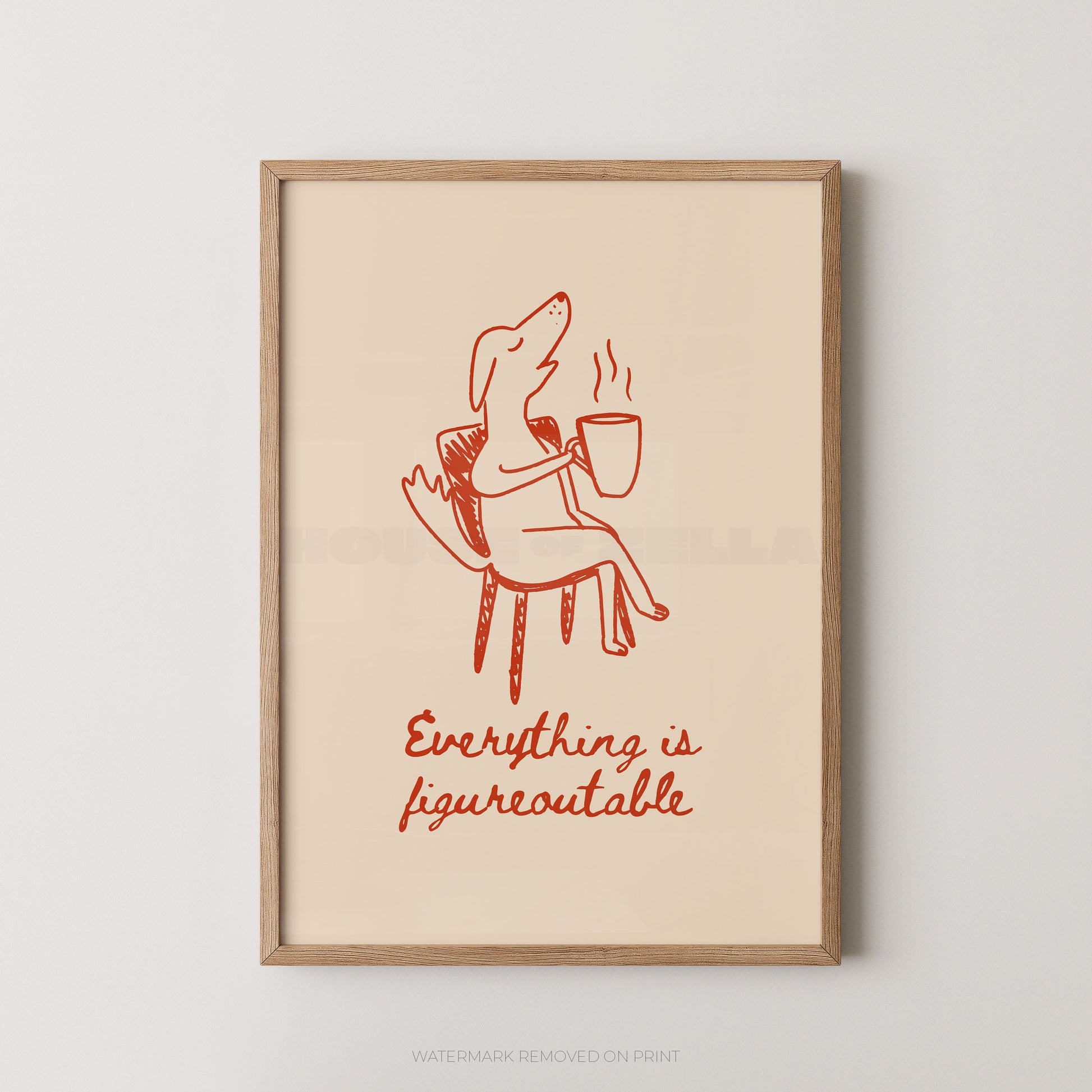 Framed artwork with a red illustration of a person on a chair holding a cup and text 'Everything is figureoutable' on a beige background.