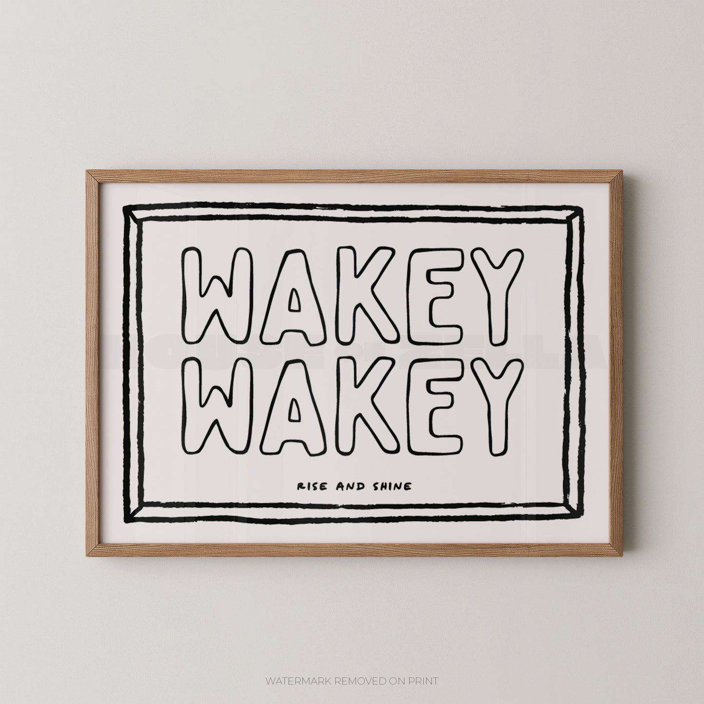 Framed print with 'Wakey Wakey' text on a light background