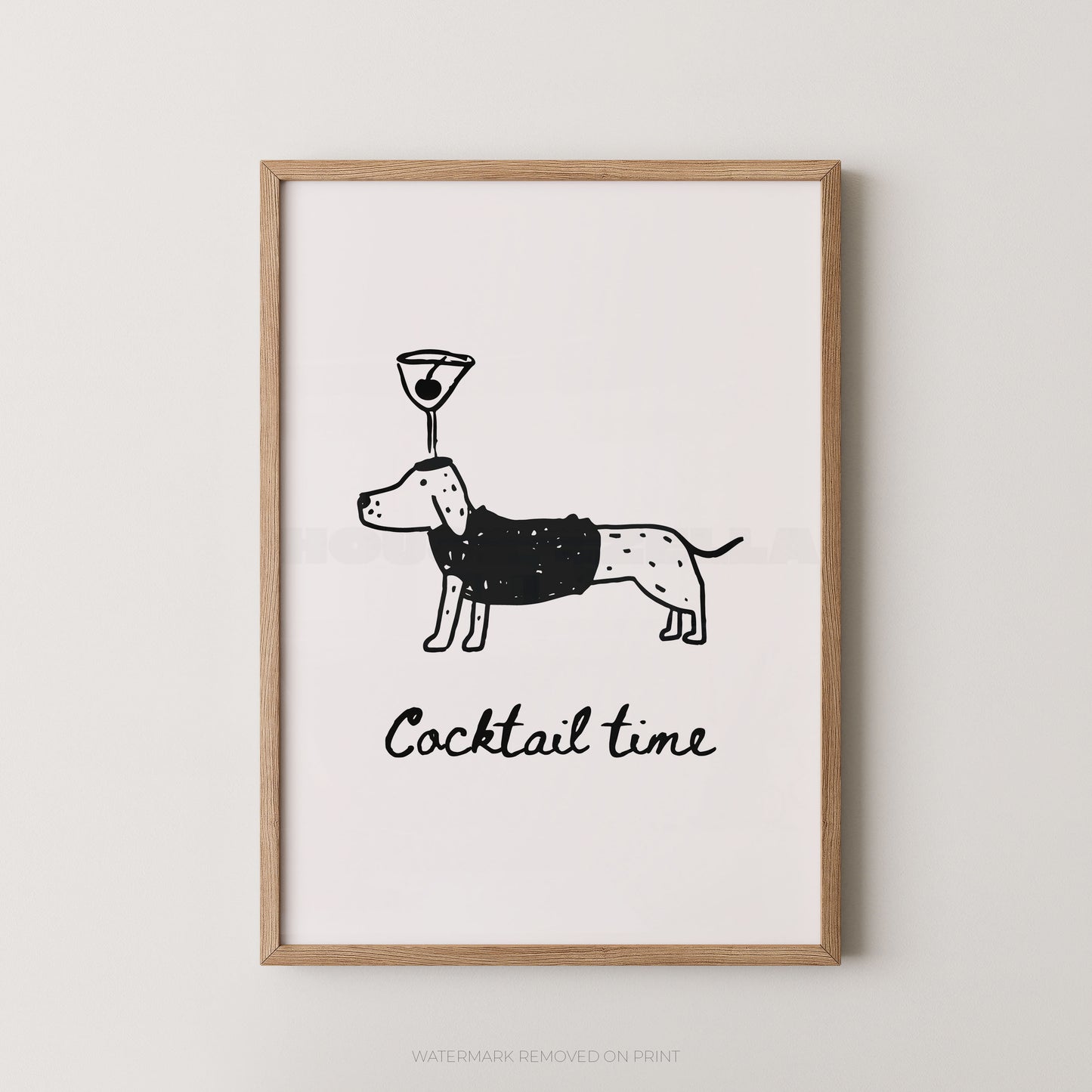 Framed wall art print featuring a minimalist black line drawing of a dachshund wearing a martini glass on its head, with the text 'Cocktail time' below, shown in a light wood frame against a light gray wall.