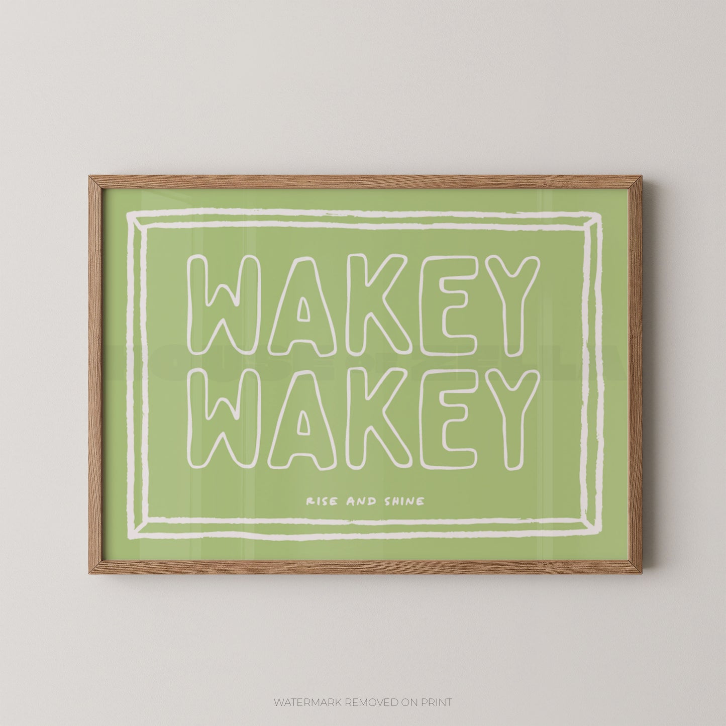 Framed print with 'Wakey Wakey' text on a green background