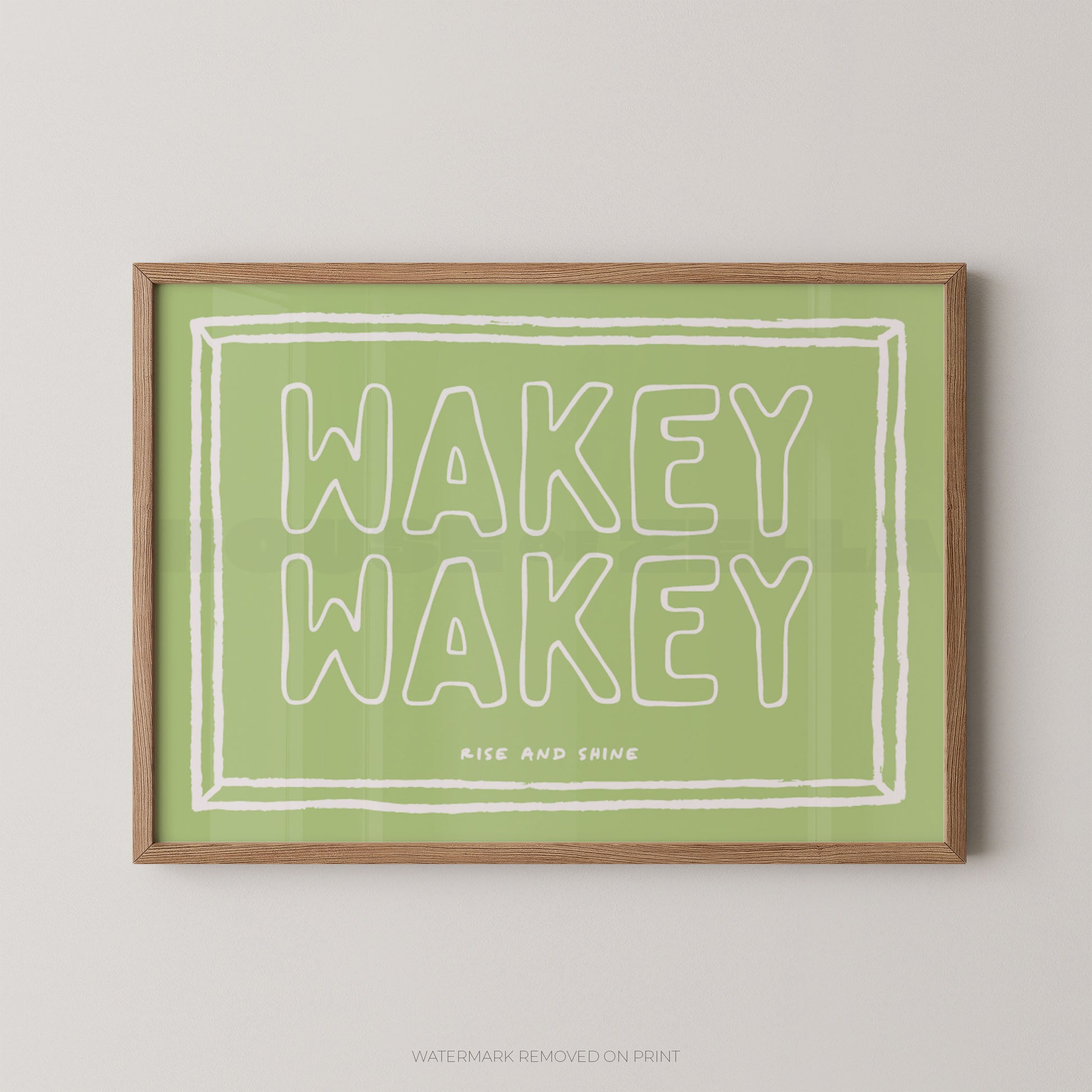 Framed print with 'Wakey Wakey' text on a green background