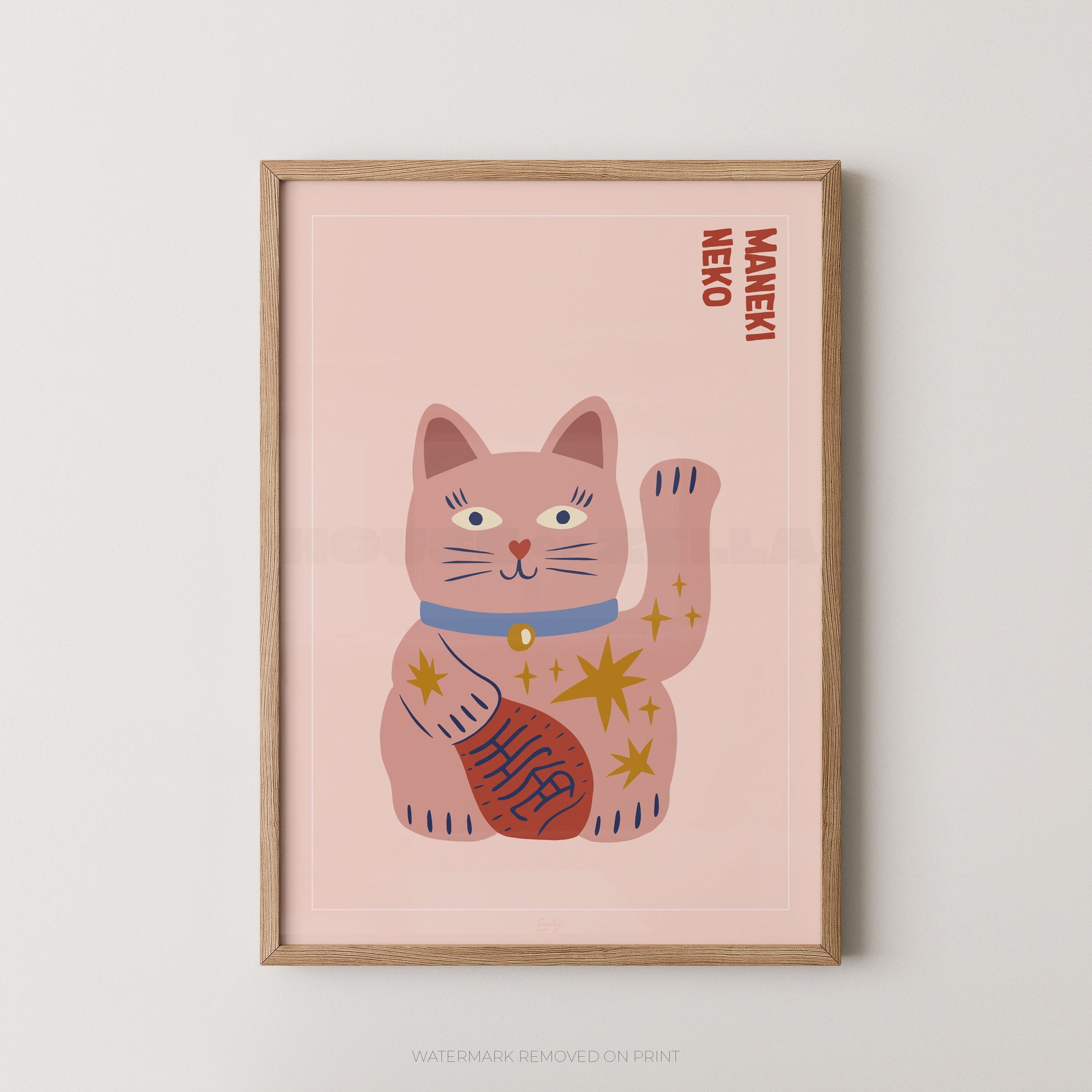 Framed artwork of a pink cat illustration with 'Maneki Neko' text on a light pink background.
