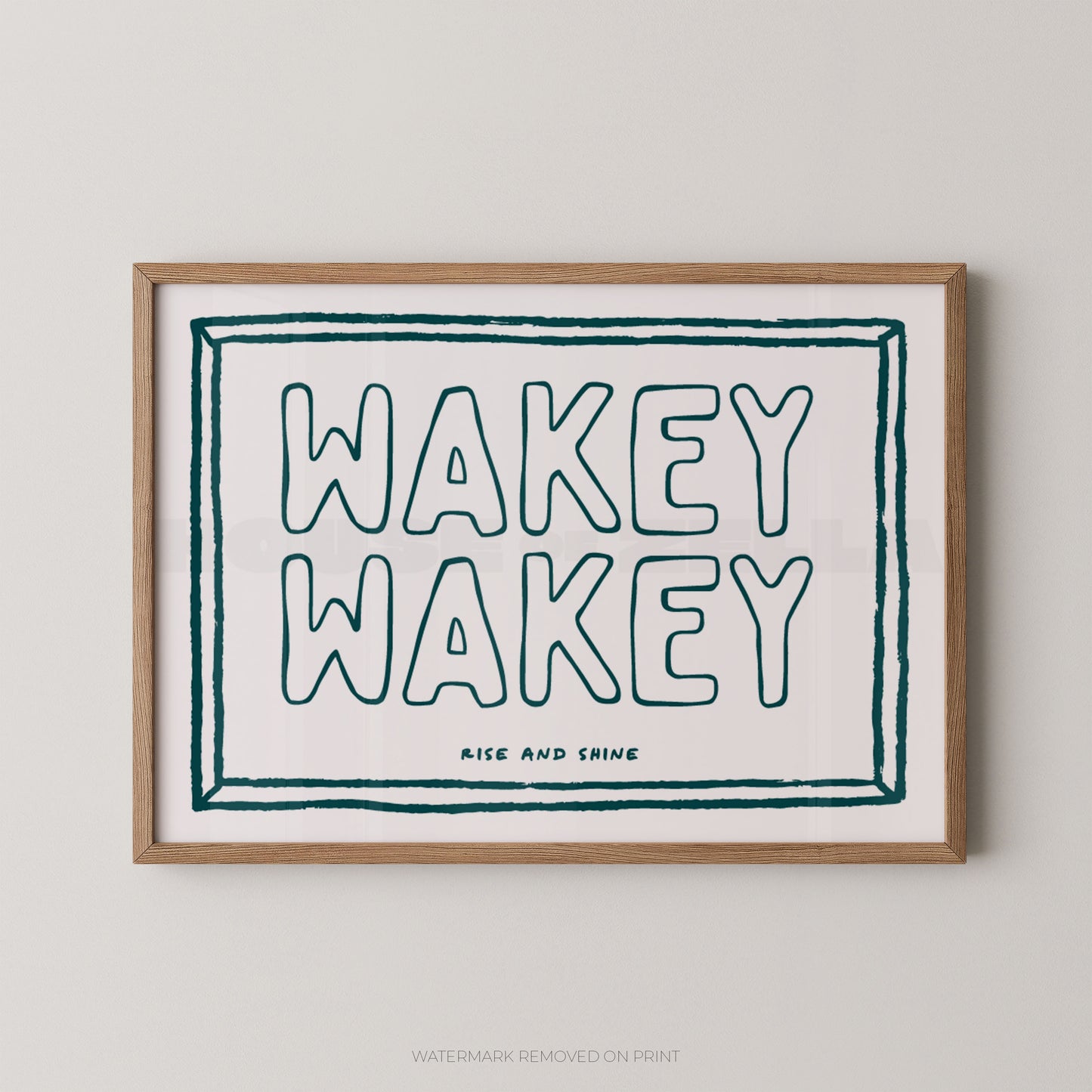 Framed print with 'Wakey Wakey' text on a plain background