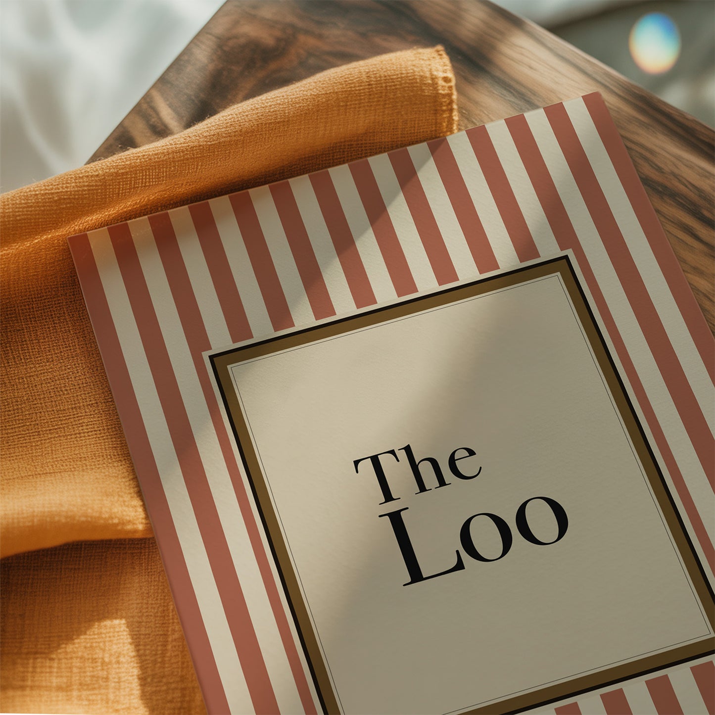 Stripped menu with 'The Loo' on a wooden table