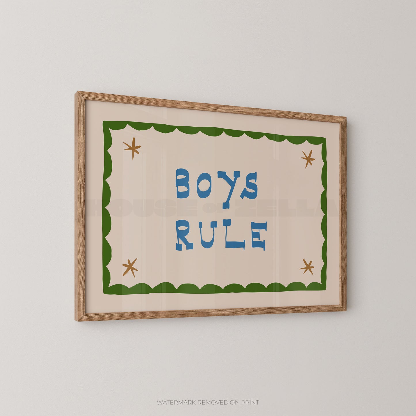 "Boys Rule children's wall art print with bold blue retro lettering on a cream background, green scallop border with gold star details, displayed at an angle in an oak frame"

