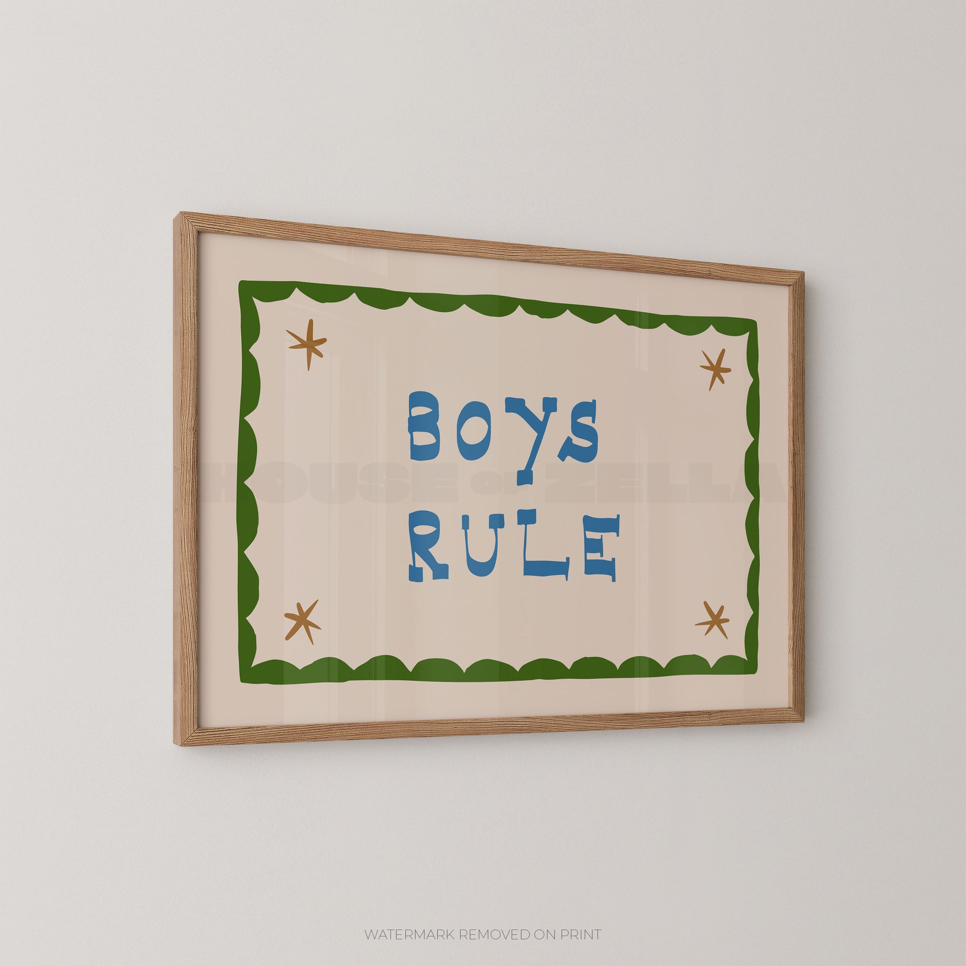 "Boys Rule children's wall art print with bold blue retro lettering on a cream background, green scallop border with gold star details, displayed at an angle in an oak frame"

