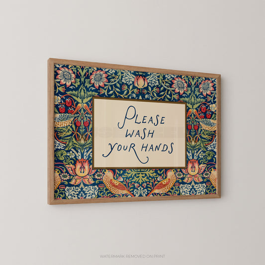 Decorative sign with floral border and 'Please Wash Your Hands' text on a plain background