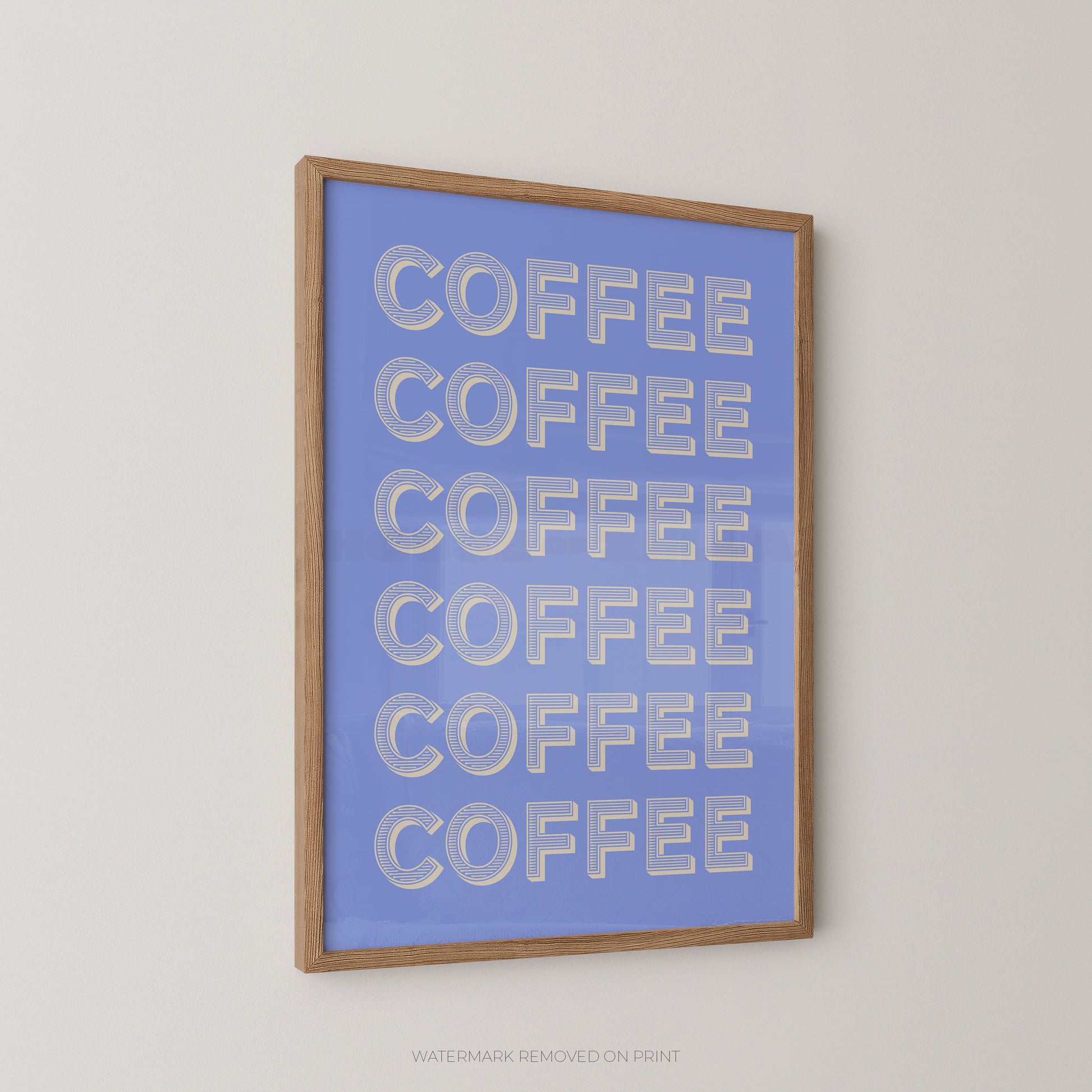 Framed wall art featuring the word 'COFFEE' repeated six times in large white letters on a light blue background, shown hanging on a plain light wall.