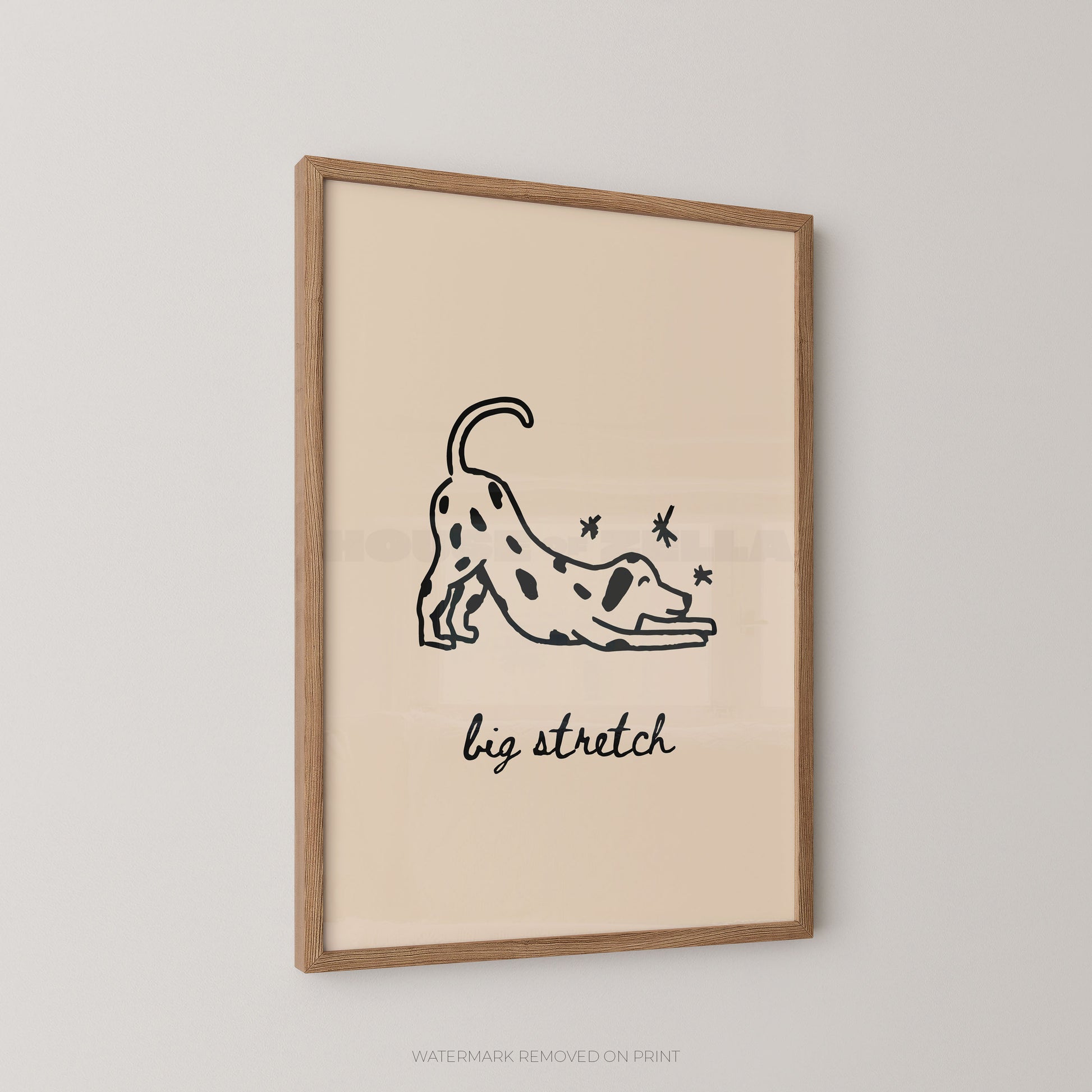Framed artwork with a black line drawing of a dog stretching and the text 'big stretch' on a beige background.