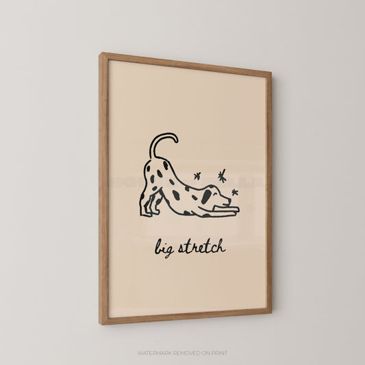 Framed artwork with a black line drawing of a dog stretching and the text 'big stretch' on a beige background.