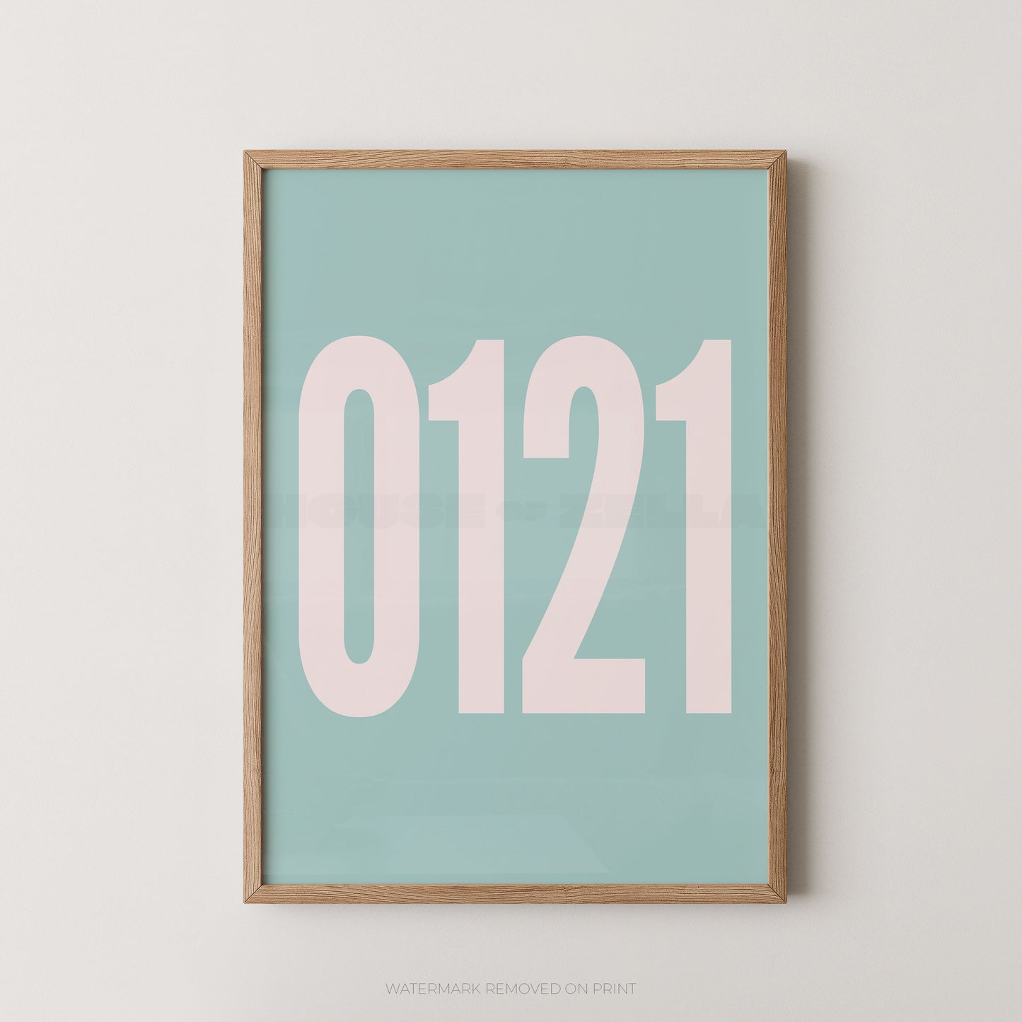 A framed minimalist art print featuring '0121' in white on a light blue background, enclosed in a natural wood frame.