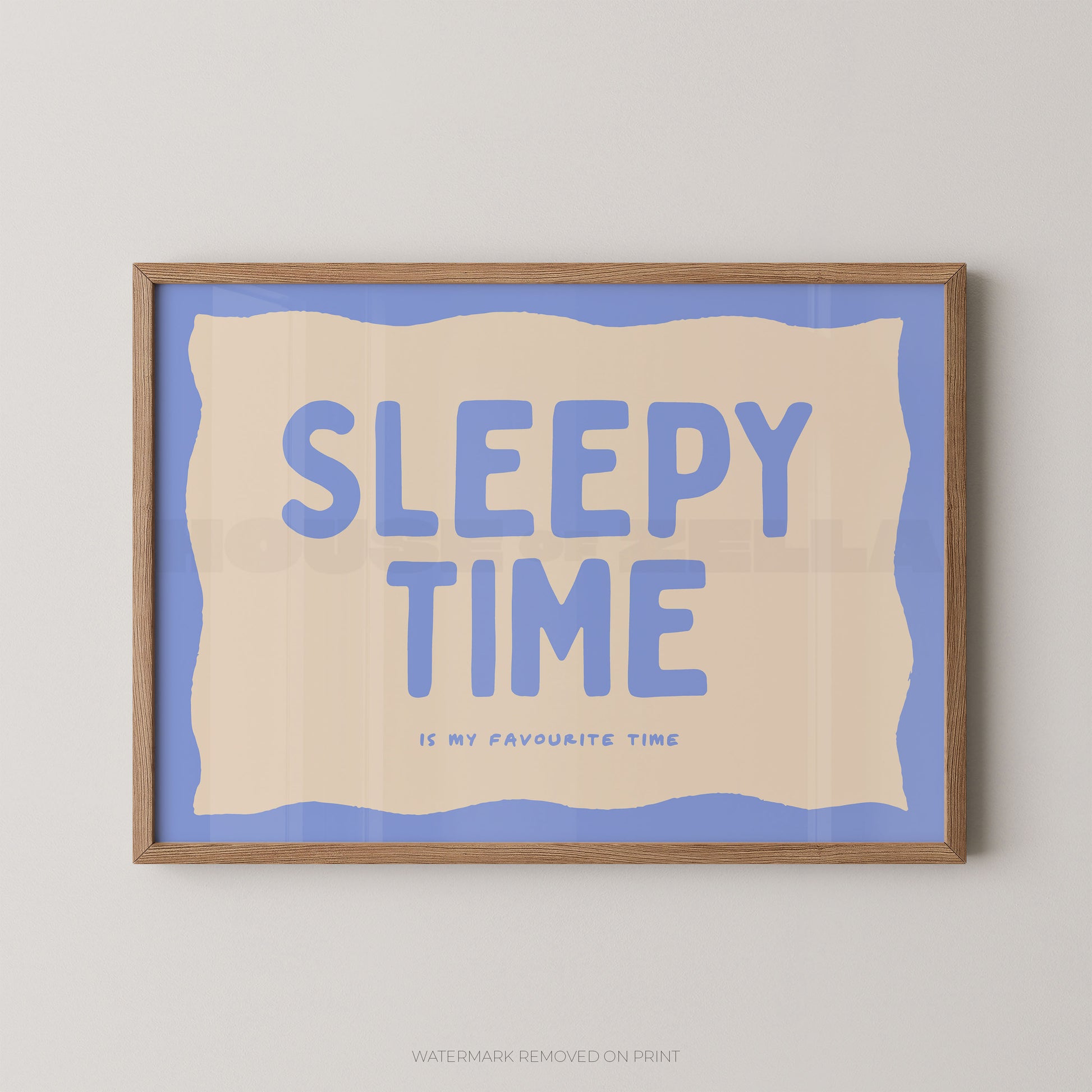 Framed artwork with 'Sleepy Time is my favourite time' text on a blue background