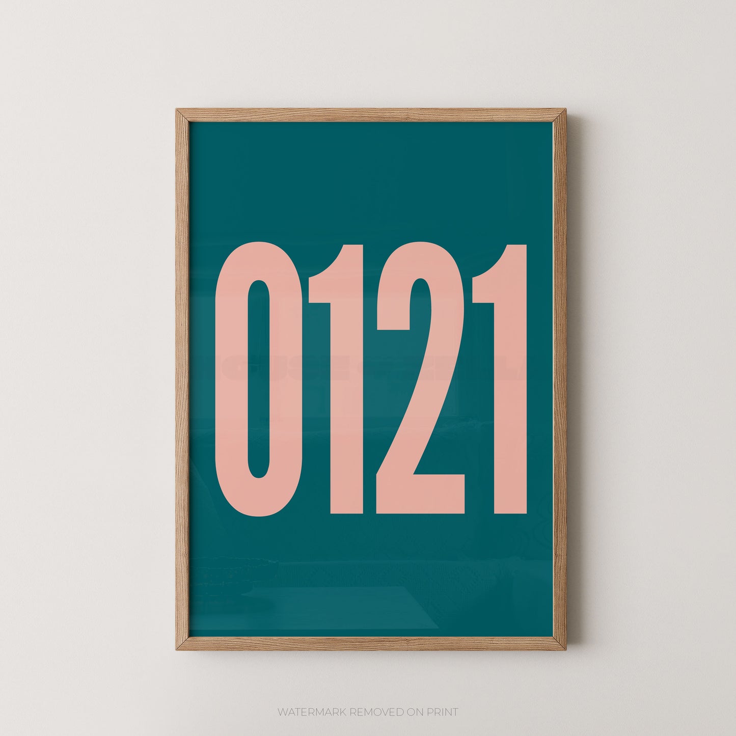 A framed minimalist art print featuring '0121' in pink on a teal background, enclosed in a natural wood frame.