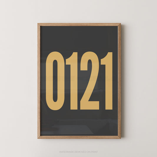 Framed wall art print with '0121' in large gold font on a dark charcoal background, framed against a light wall.