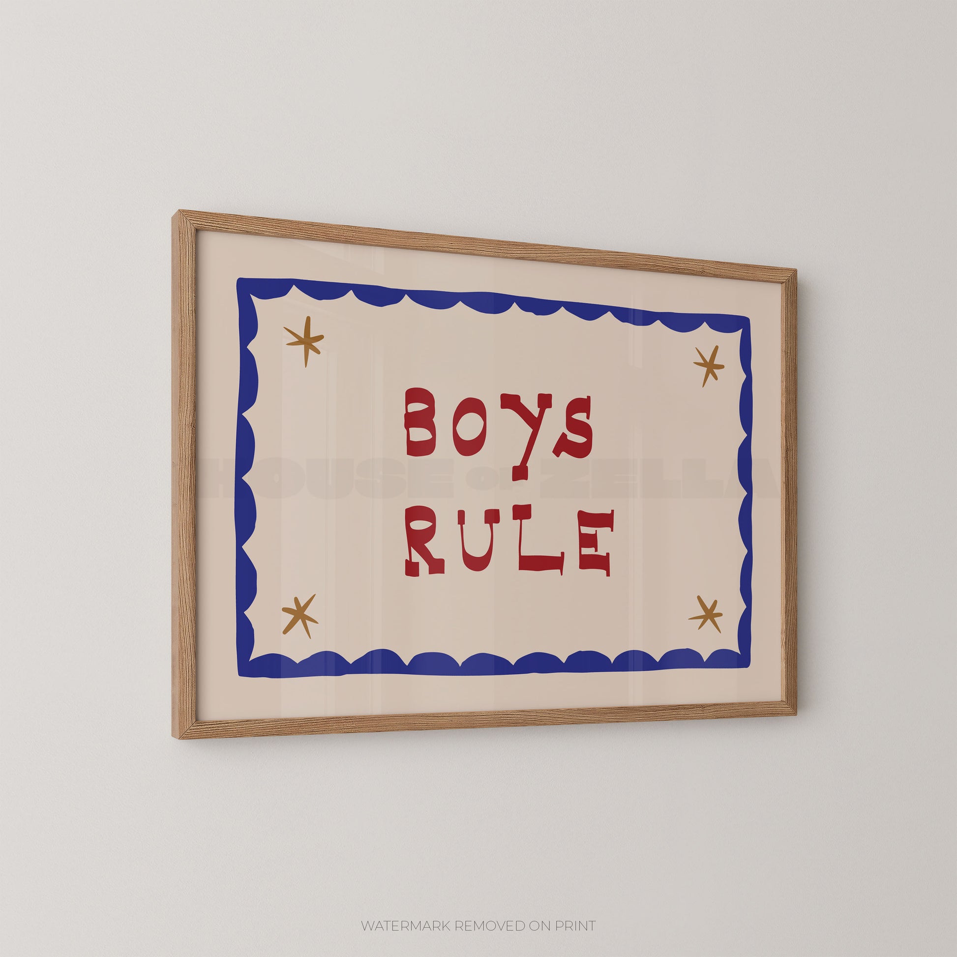 Framed artwork with 'Boys Rule' text on a plain wall