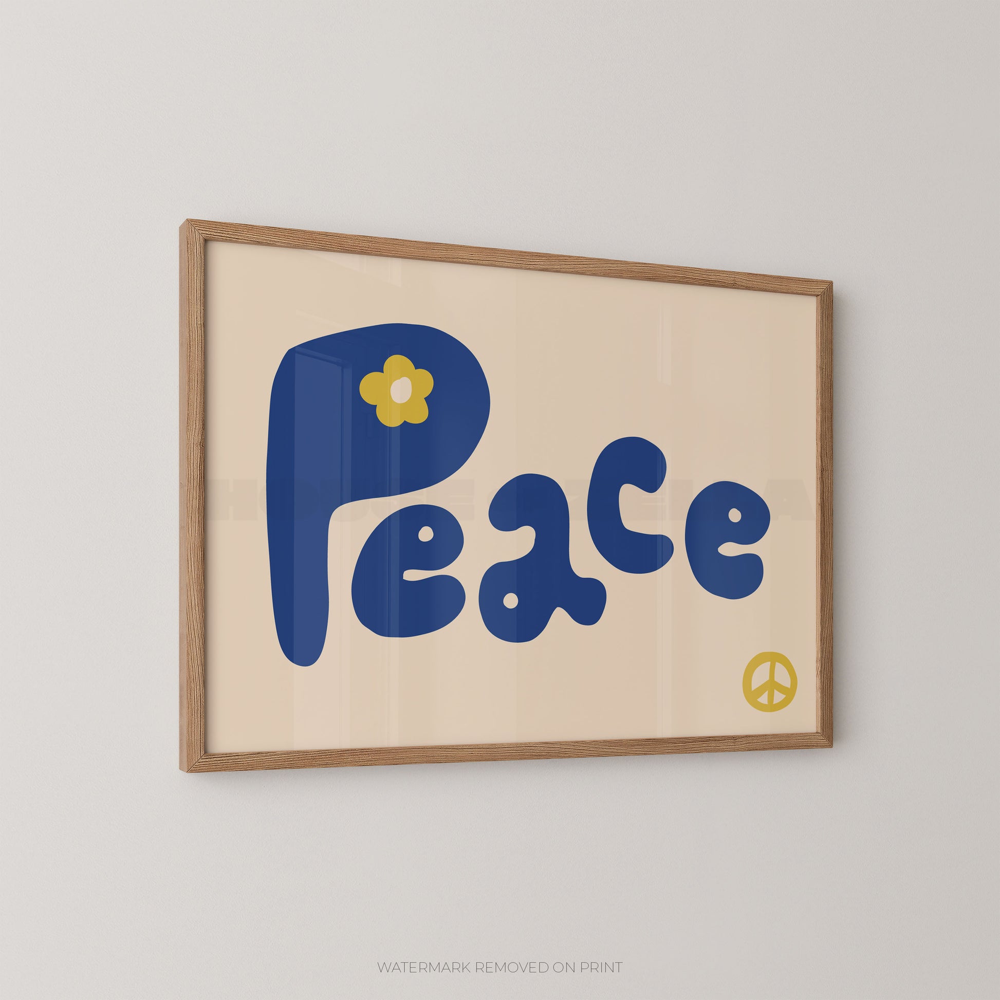 Framed retro-style wall art featuring the word 'Peace' in large blue retro letters on a cream background, with a small yellow flower on the 'P' and a yellow peace sign in the lower right. The print is shown hanging on a light gray wall.