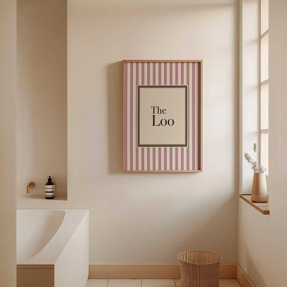 Bathroom with a framed picture on the wall displaying 'The Loo'.