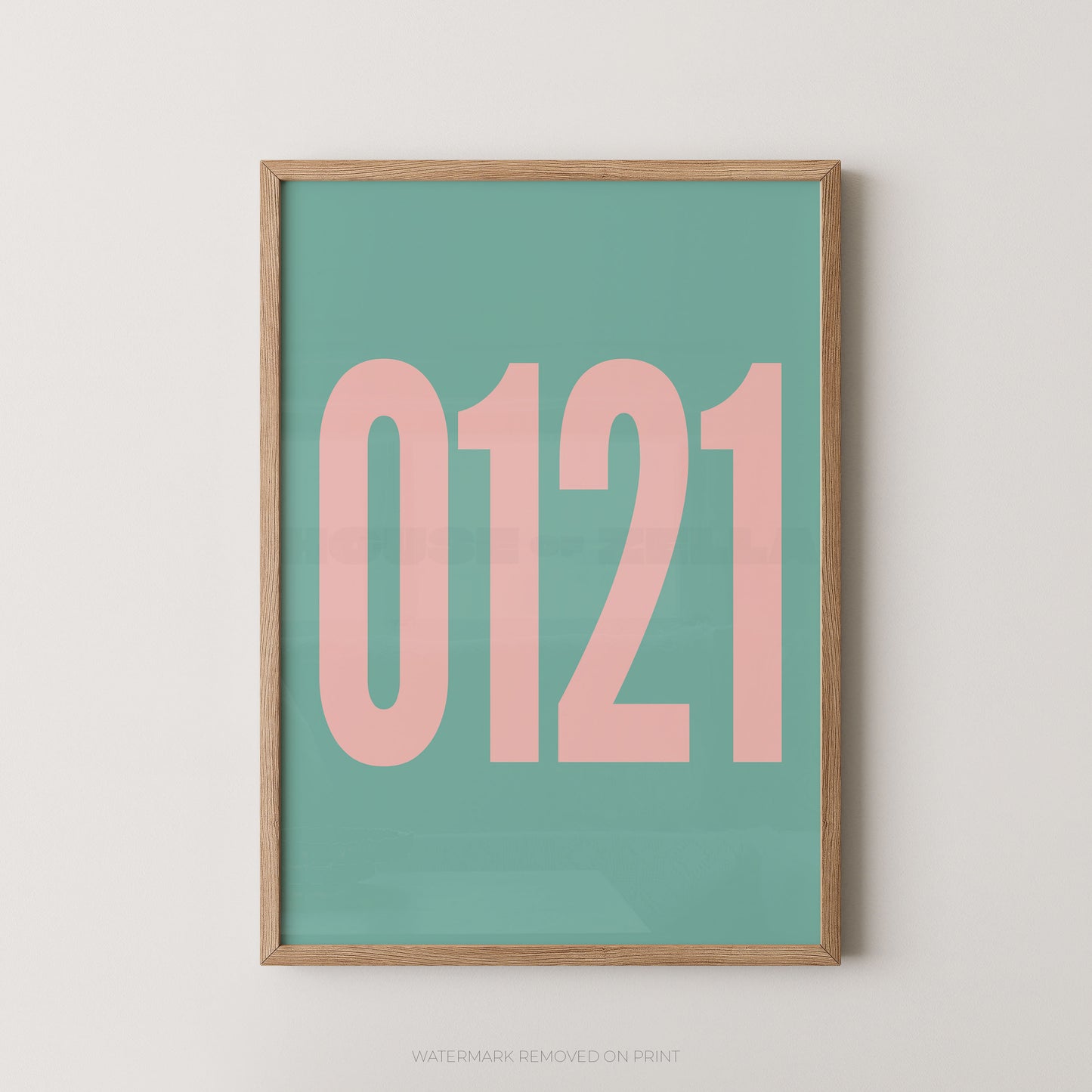 A framed minimalist art print featuring '0121' in pink on a blue background, enclosed in a natural wood frame.