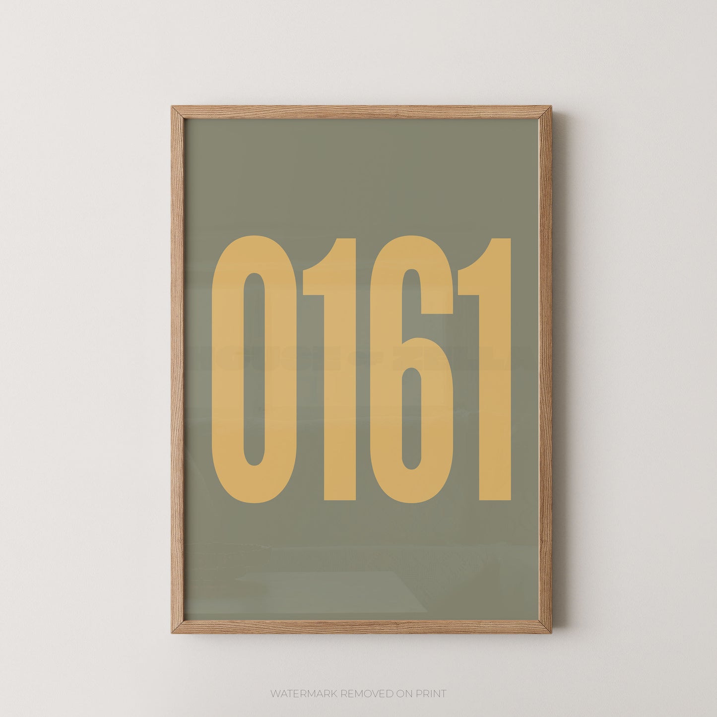 A framed minimalist art print featuring the numbers '0161' in a muted mustard yellow on a sage green background, enclosed in a light natural wood frame.