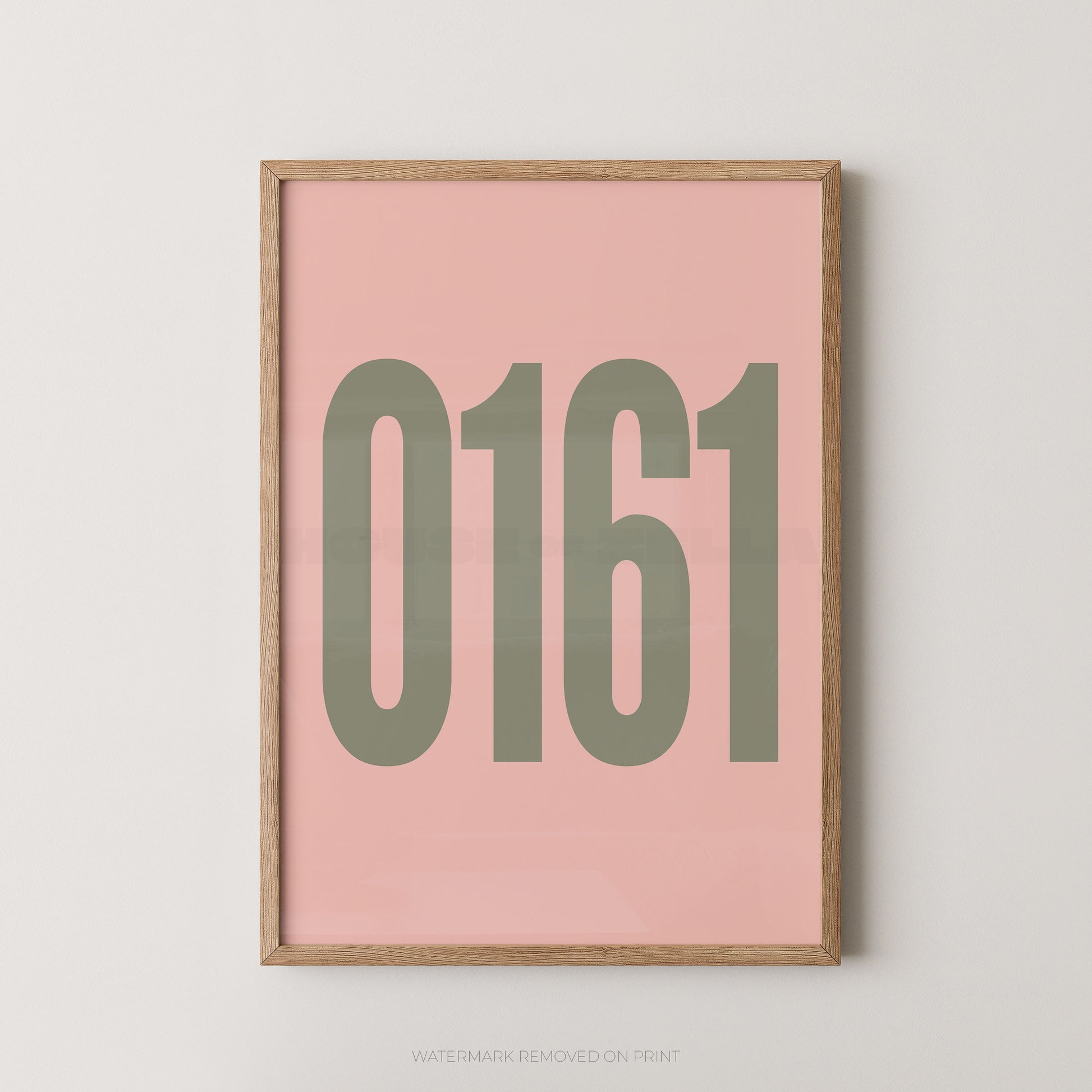 Framed minimalist wall art print with the numbers '0161' in muted olive green on a soft pink background, set in a light natural wood frame against a light gray wall.