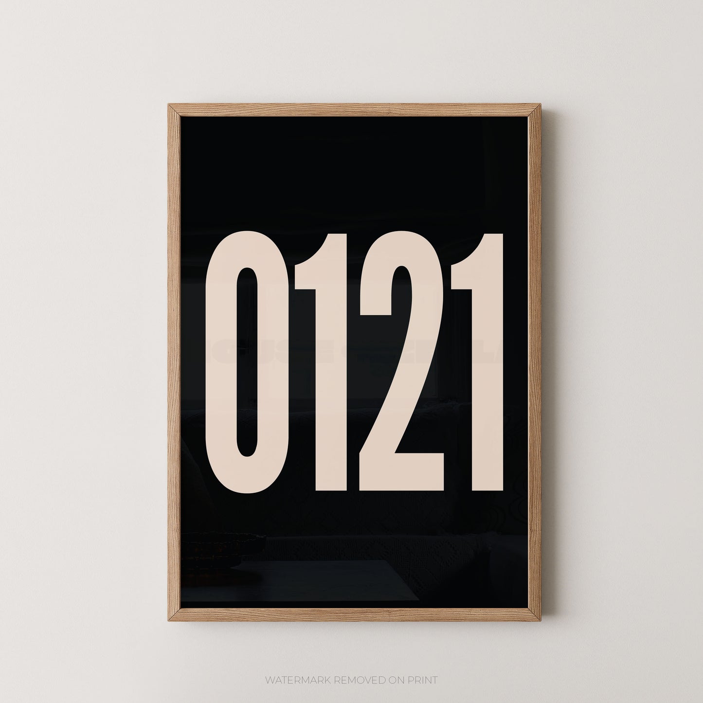 A framed minimalist art print featuring '0121' in white on a black background, enclosed in a natural wood frame.