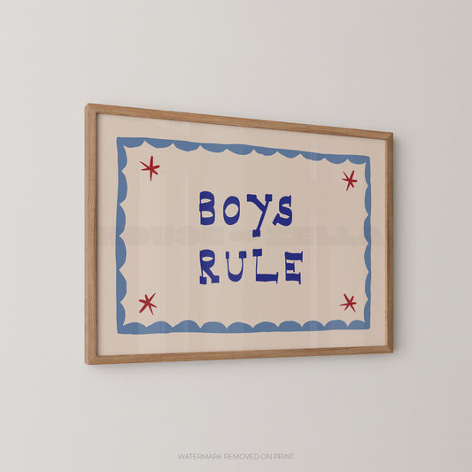 "Boys Rule children's wall art print with bold dark blue retro lettering on a cream background, light blue scallop border with red star details, displayed at an angle in an oak frame"

