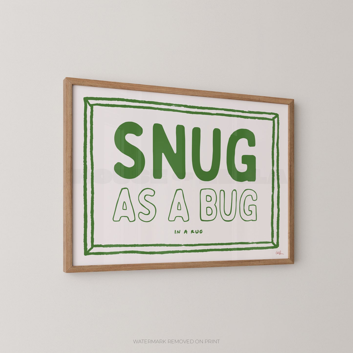 Framed print with 'SNUG AS A BUG' text on a white background