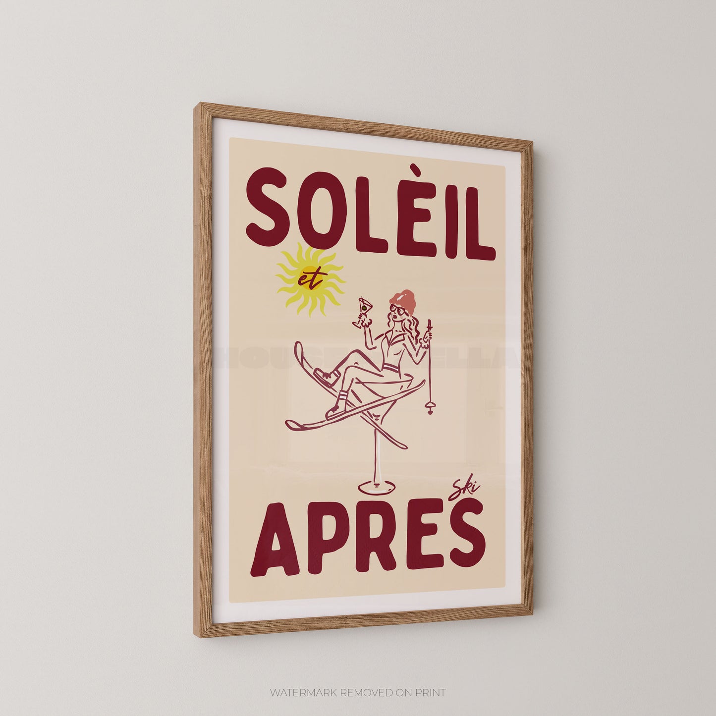 Framed vintage-style poster with the French text “SOLÉIL et APRES ski” and a simple illustration of a skier, shown hanging on a light gray wall.