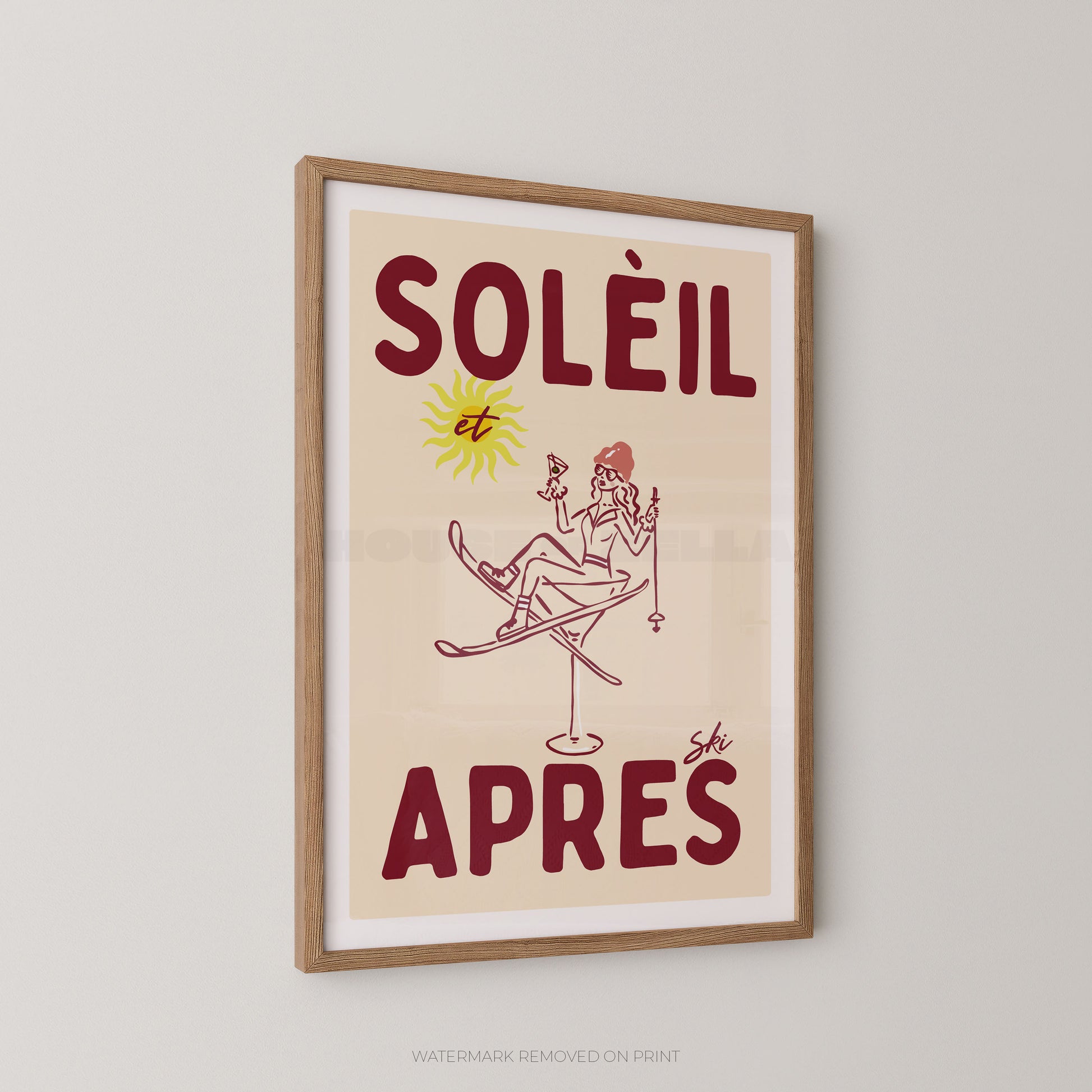 Framed vintage-style poster with the French text “SOLÉIL et APRES ski” and a simple illustration of a skier, shown hanging on a light gray wall.