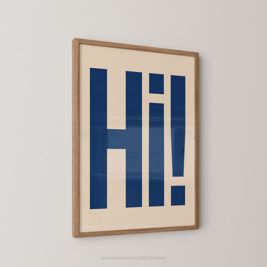 Framed typographic wall art featuring the word 'Hi!' in bold navy blue letters on a warm cream background, shown hanging on a light gray wall.