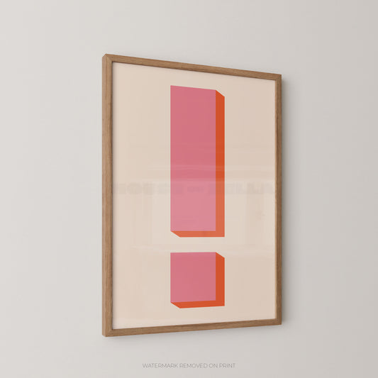 Framed minimalist wall art featuring a large pink exclamation mark with orange shadowing on a cream background, enclosed in a light wood frame and shown hanging on a light gray wall.