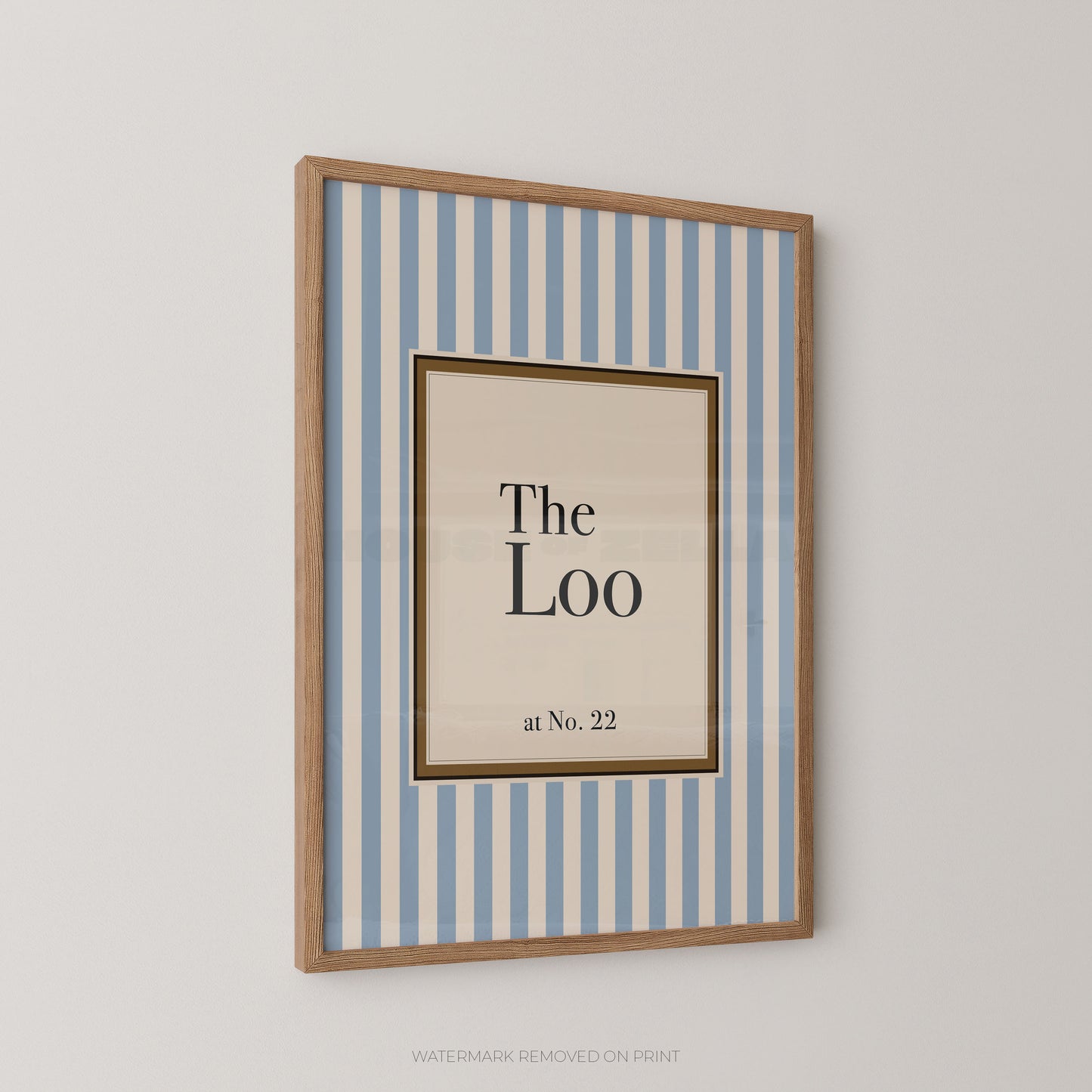 Framed artwork with 'The Loo at No. 22' text on a striped background