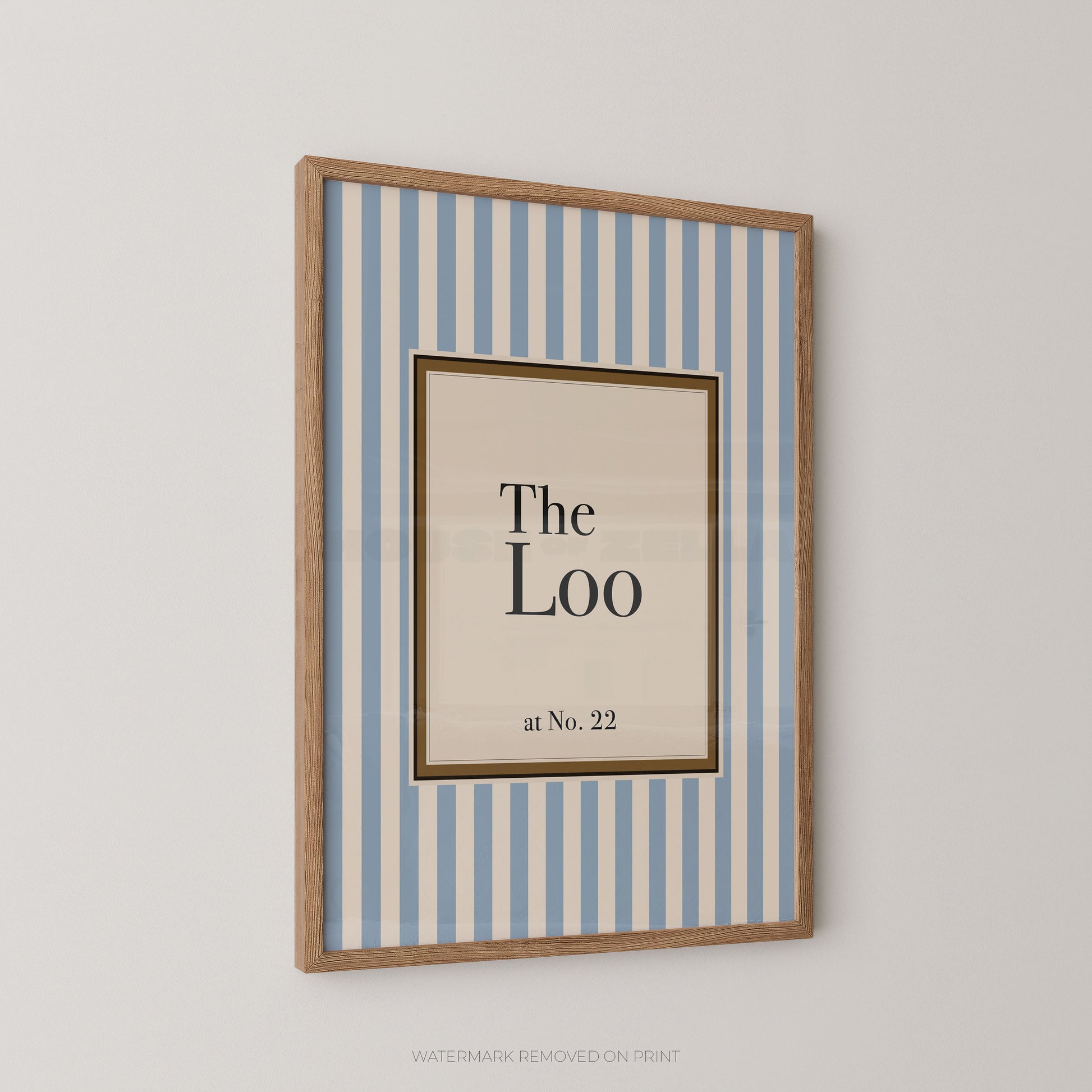 Framed artwork with 'The Loo at No. 22' text on a striped background