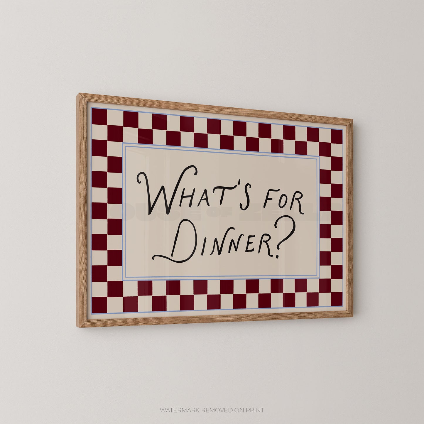 Framed sign with 'What's for Dinner?' text on a checkered border