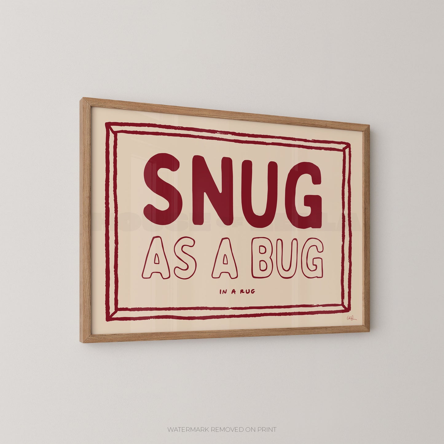 Framed print with 'SNUG AS A BUG' text on a beige background