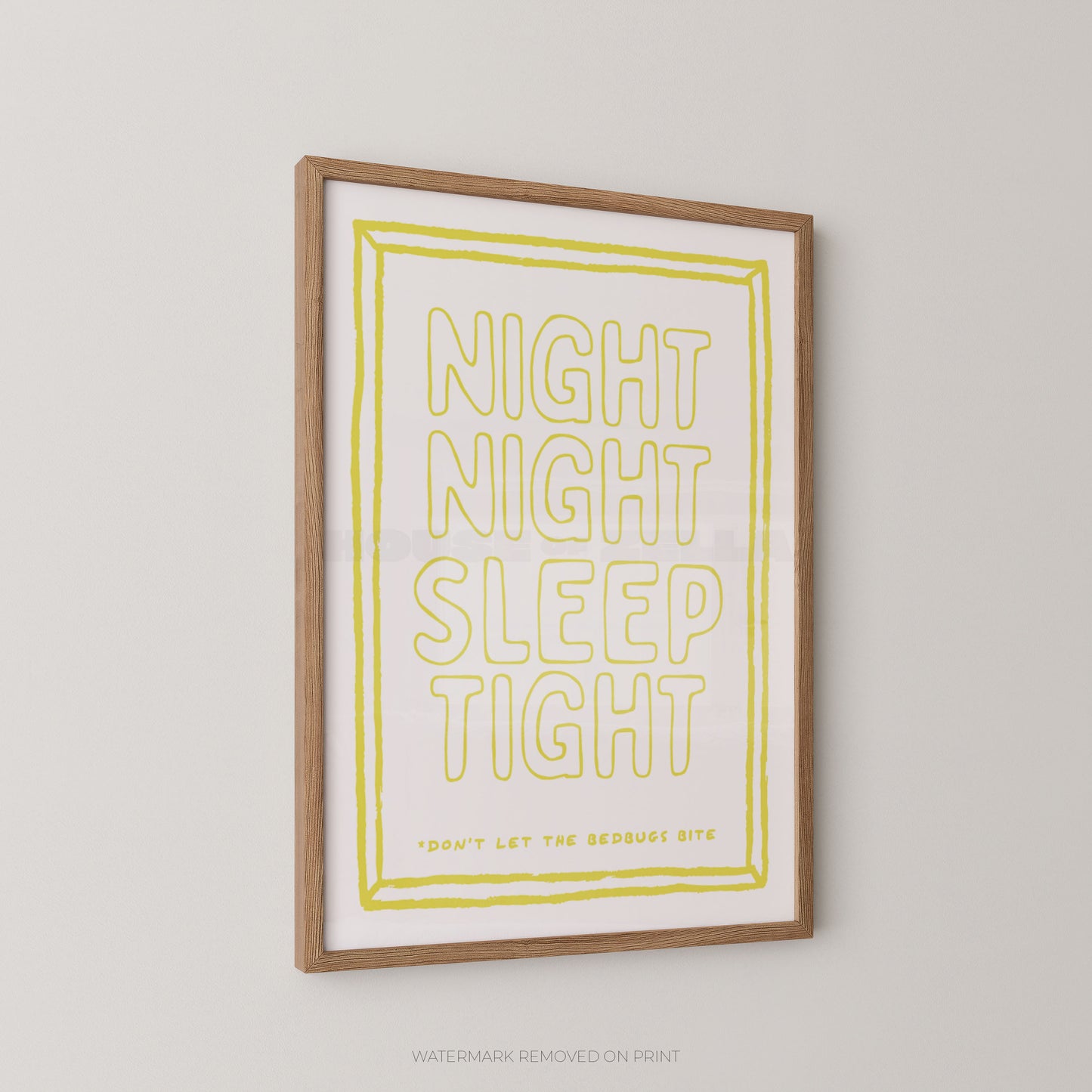 Framed wall art print with the phrase “NIGHT NIGHT SLEEP TIGHT” in large outlined yellow letters on a white background, with a light wood frame, shown hanging on a light gray wall.